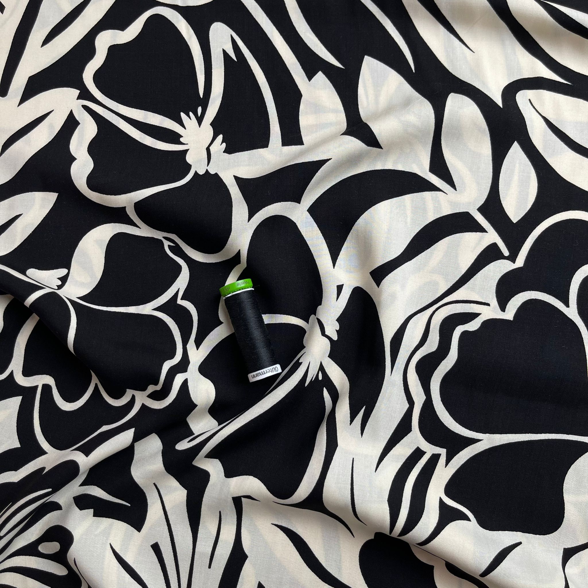 Off-White Blooms on Black Viscose Fabric