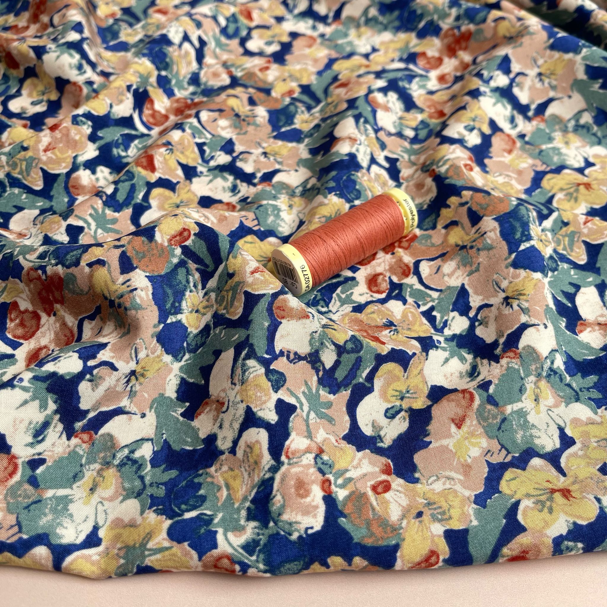 Soft Autumn Blossoms on Blue Viscose Fabric