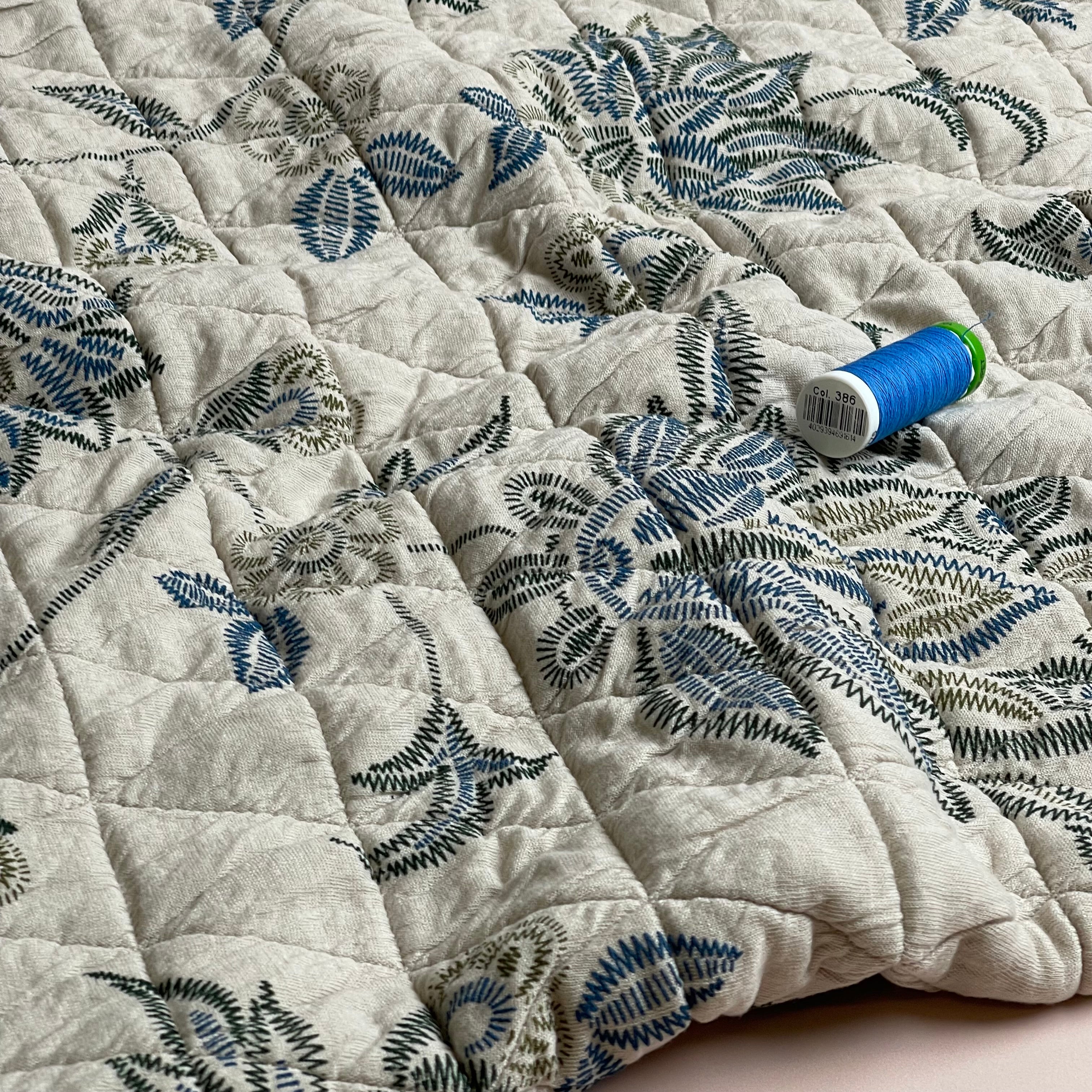 Stitched Flowers on Triangles Quilted Knit