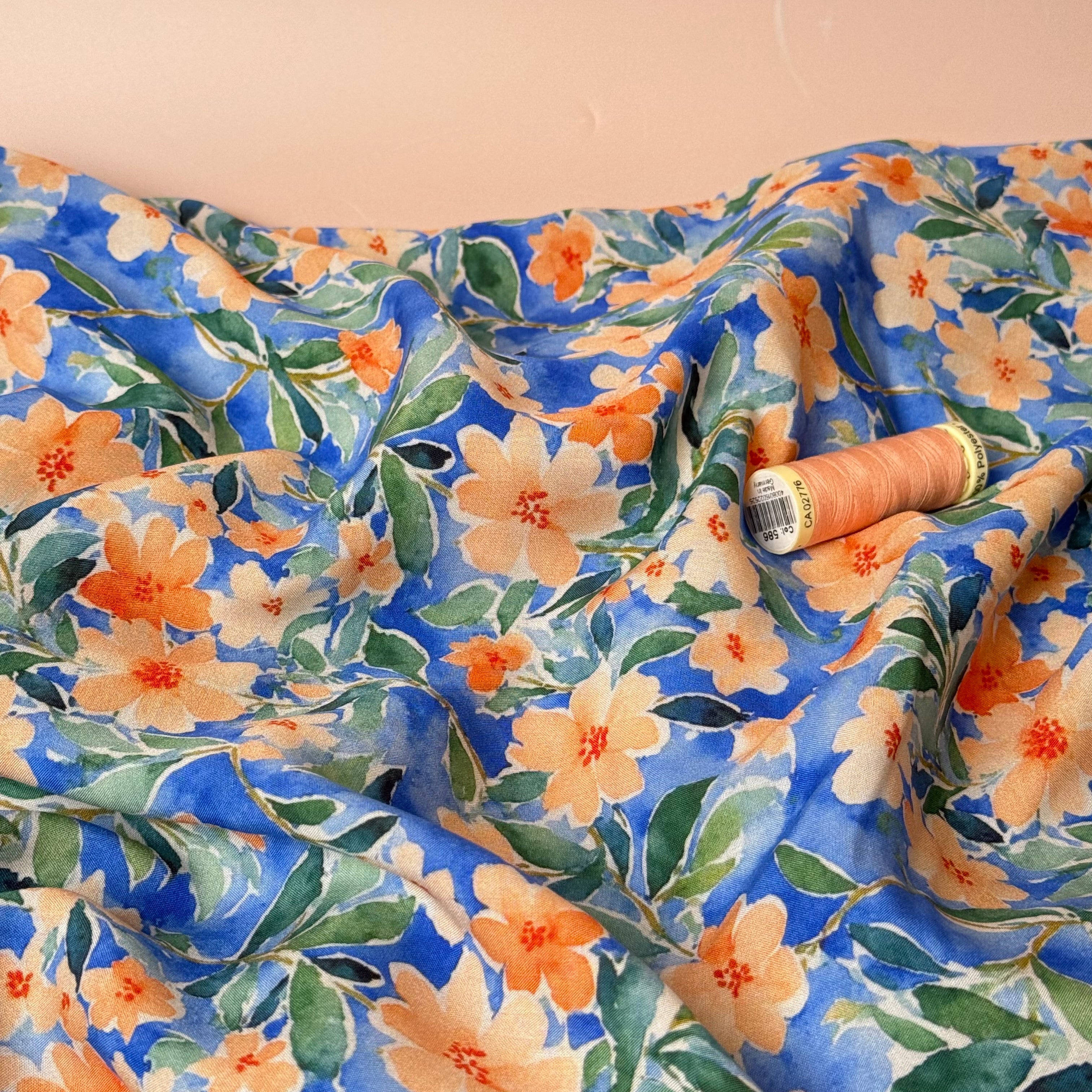 Peach Watercolour Flowers on Blue Viscose Fabric