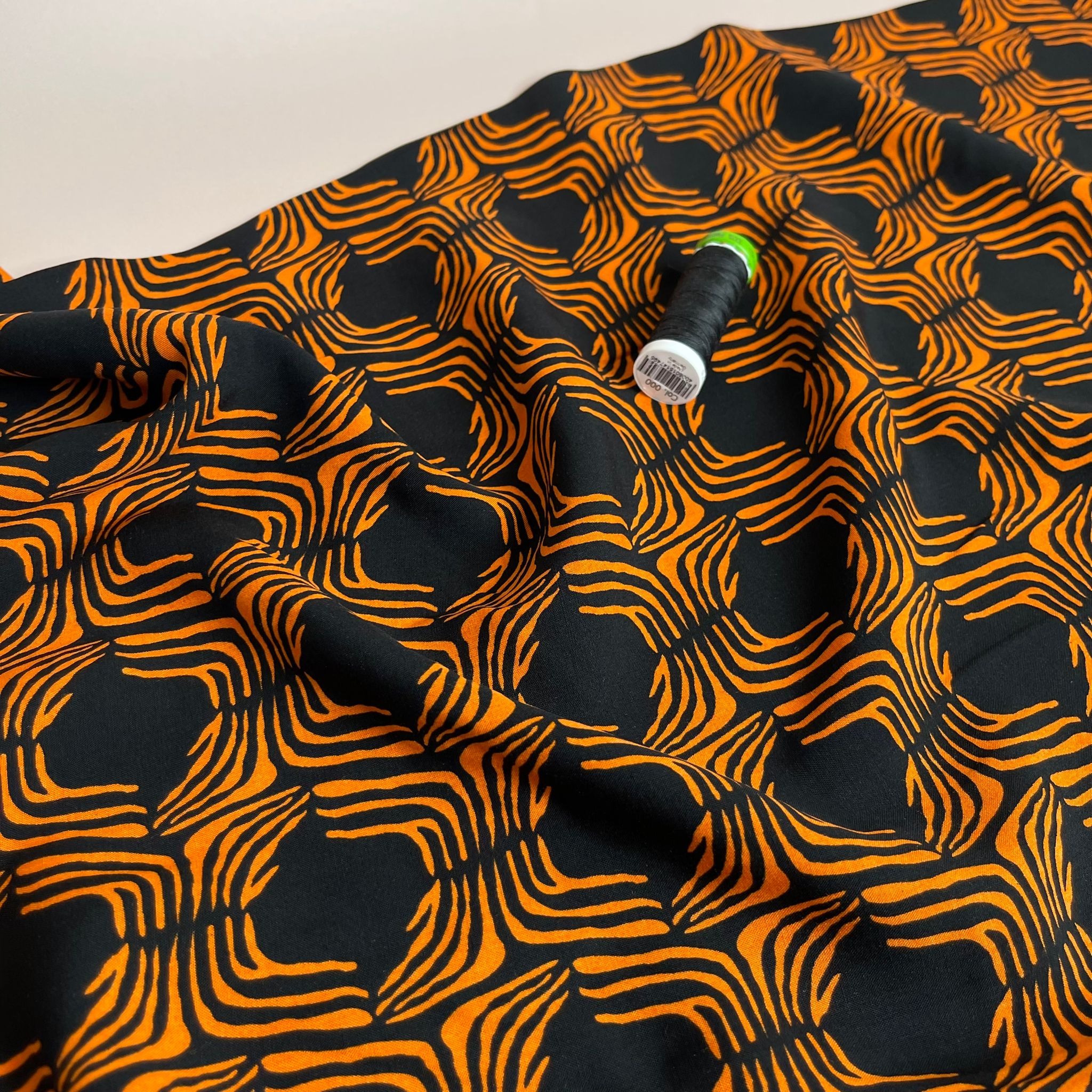 Abstract Lines in Orange on Black Viscose Poplin Fabric