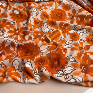 Danish Design - Rust Flowers on Pale Rose Cotton Jersey Fabric