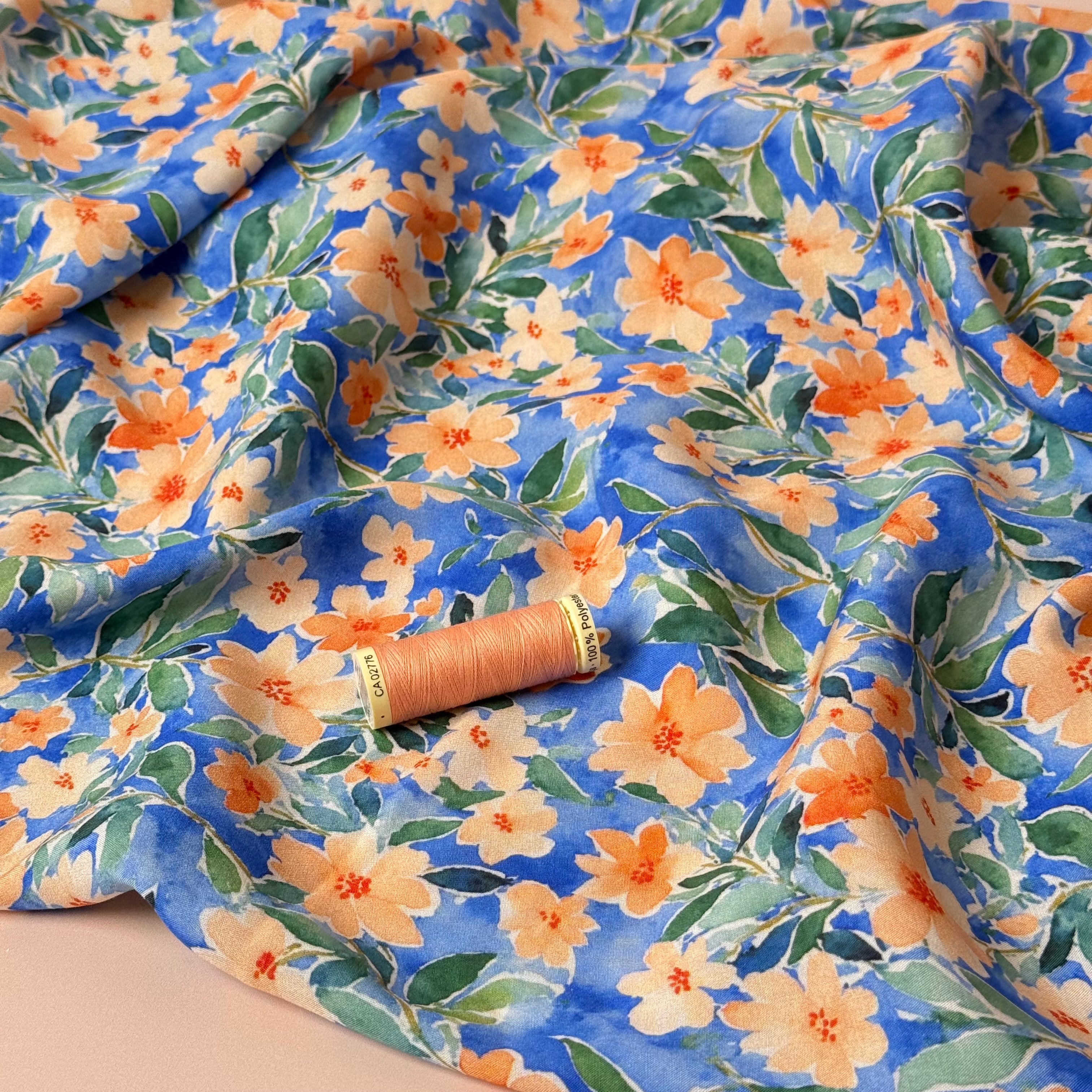 Peach Watercolour Flowers on Blue Viscose Fabric