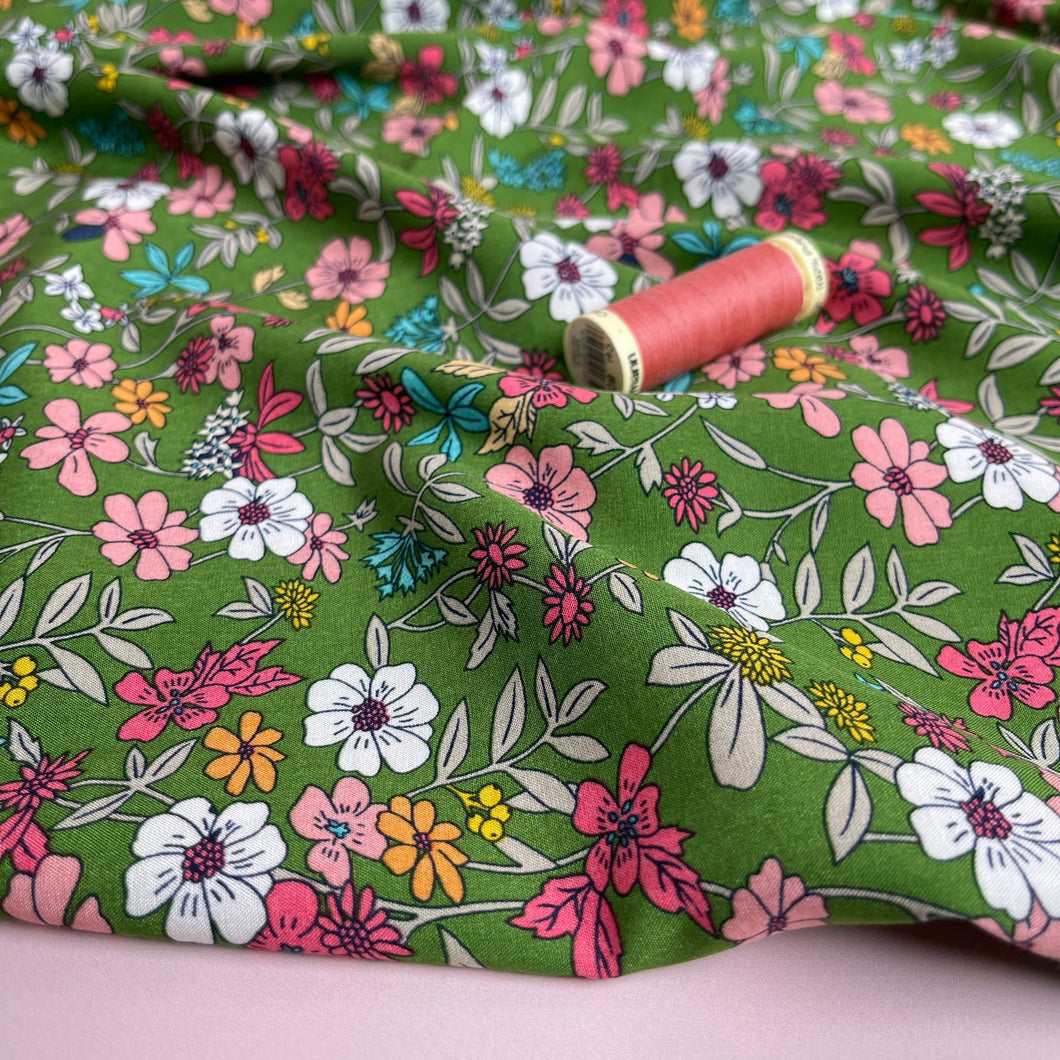 Spring Blossoms on Green Viscose Fabric