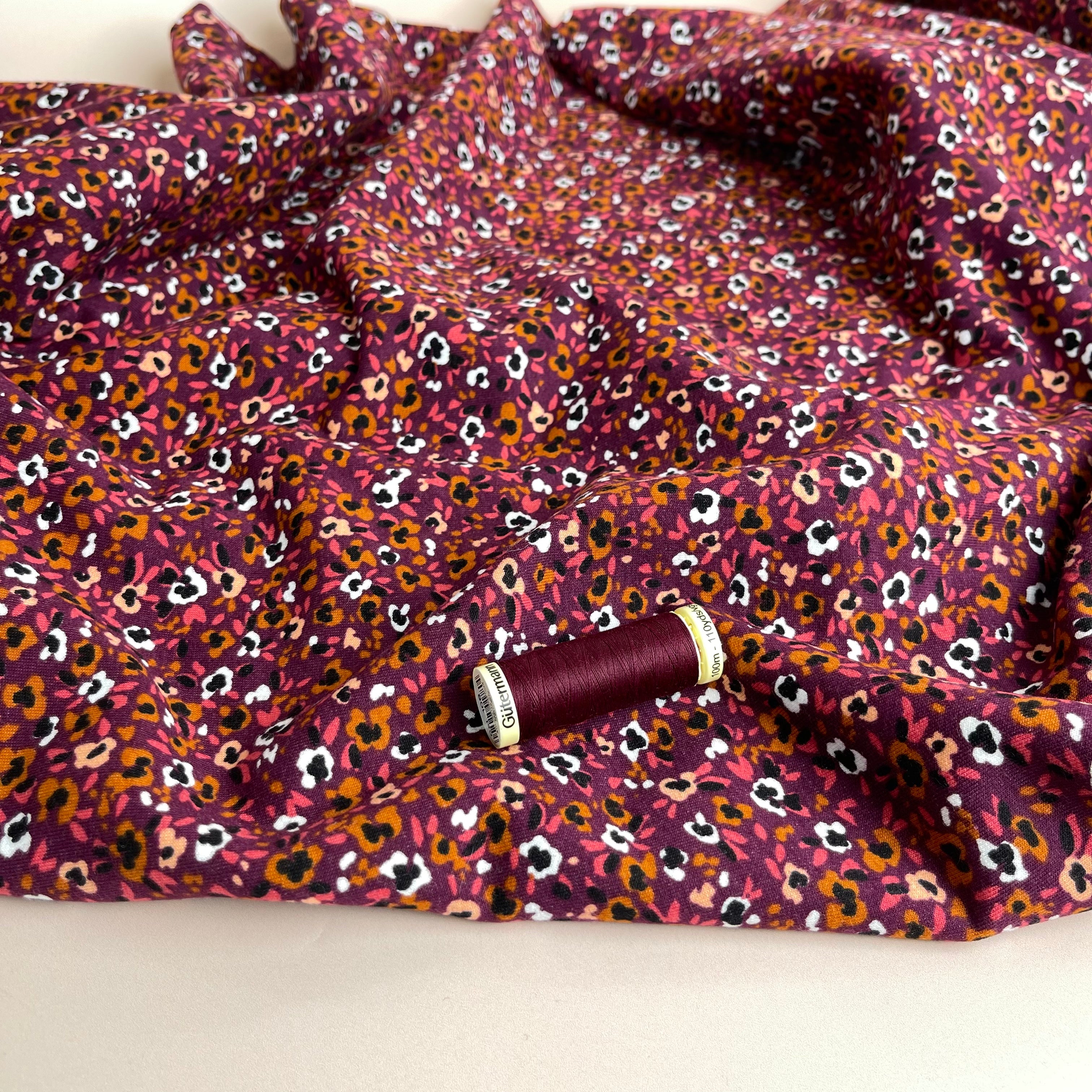 Abstract Flowers on Aubergine Peach Soft Cotton Sweat-shirting Fabric