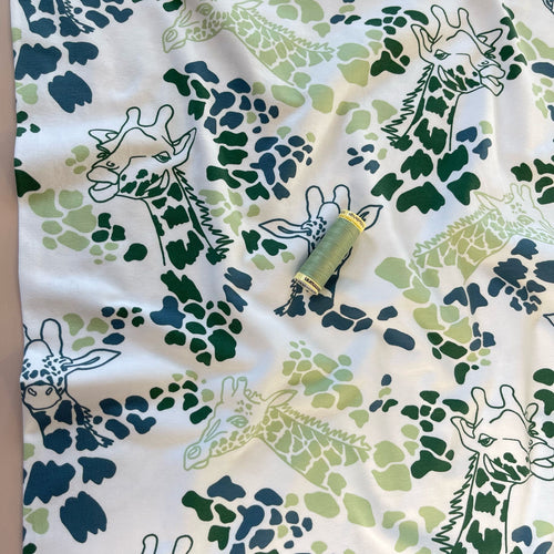 Giraffe's in Green Cotton Jersey Fabric
