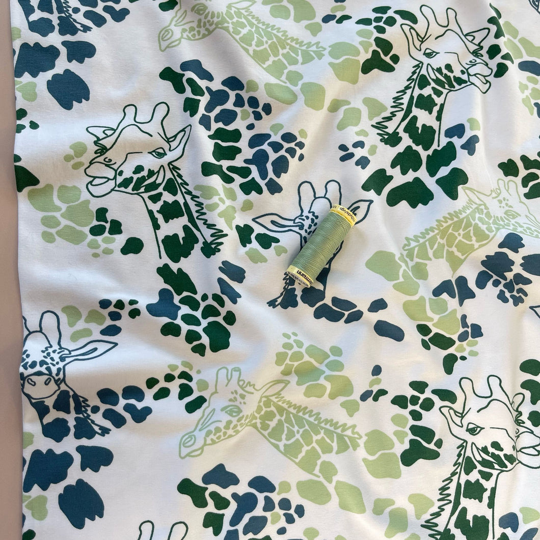 Giraffe's in Green Cotton Jersey Fabric