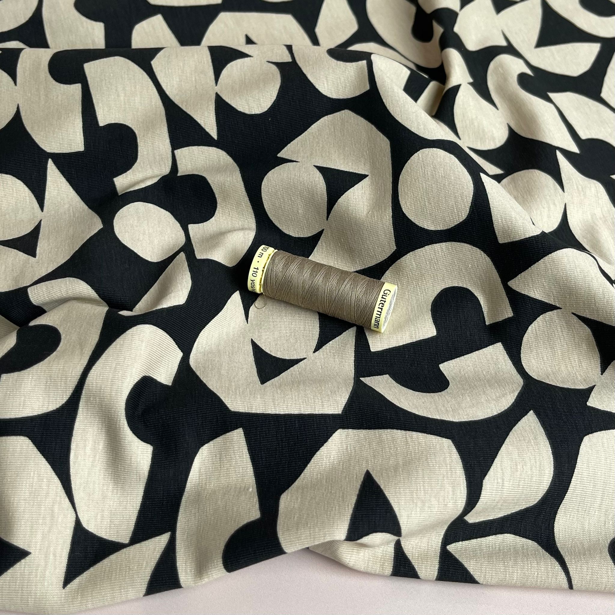 Cream Shapes on Black Combed Cotton Jersey Fabric
