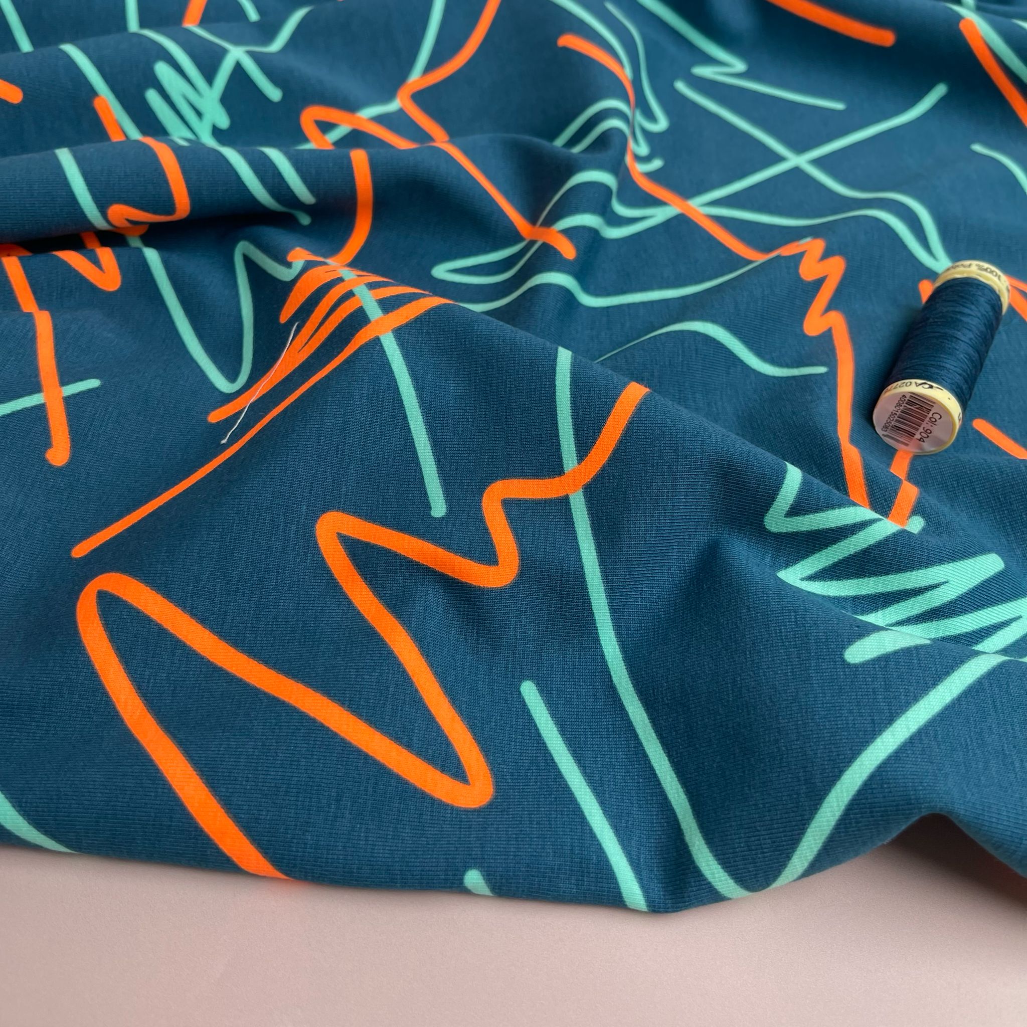 Neon Doodles on Dark Teal Cotton Jersey Fabric