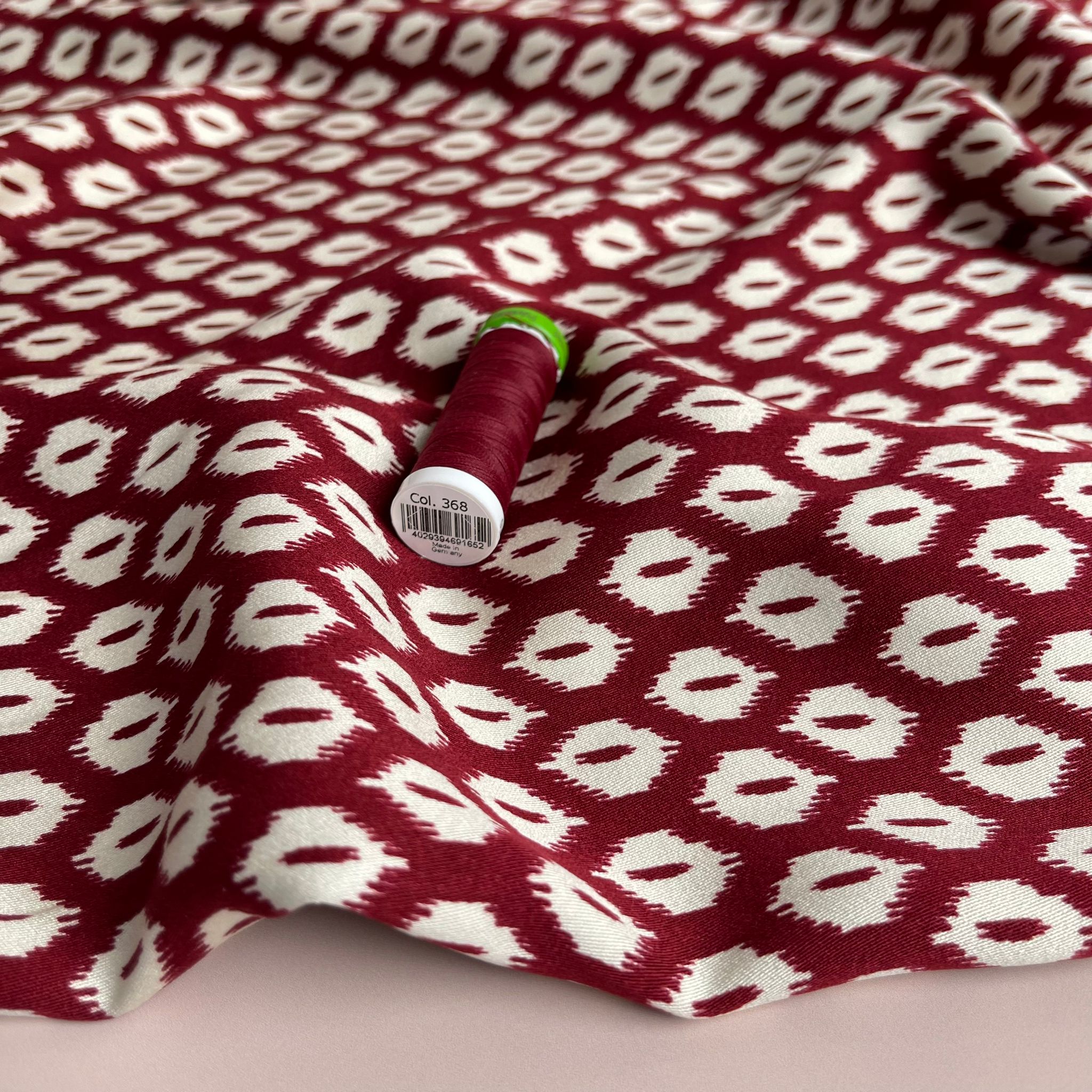 REMNANT 1.79 Metres (plus extra section with slight fading)  - Abstract Rhombus on Burgundy Viscose Twill Sateen Fabric