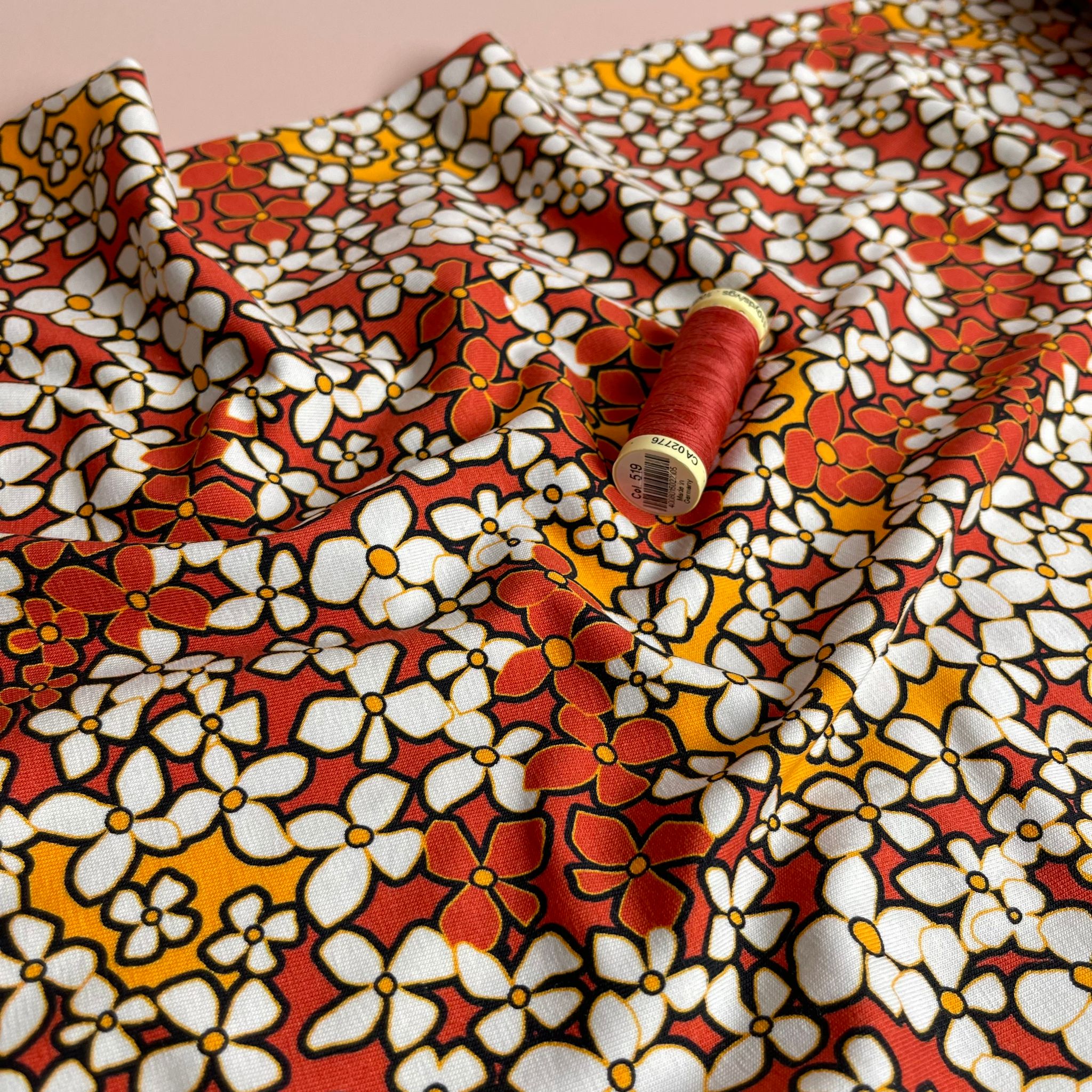 Danish Design - Small Retro Flowers on Burnt Orange Cotton Jersey Fabric