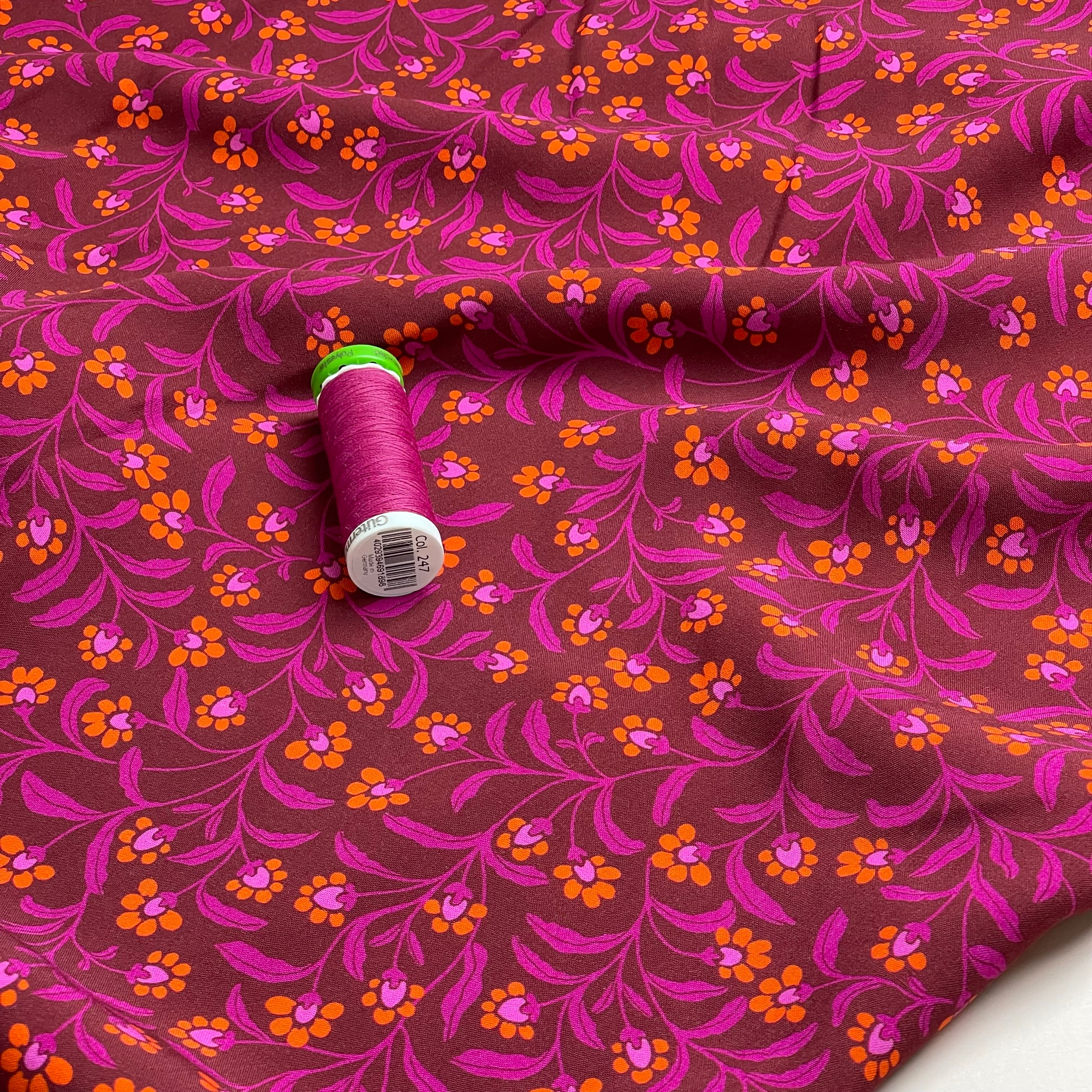 Ditsy Orange Flowers on Burgundy Viscose Fabric