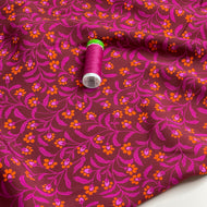 Ditsy Orange Flowers on Burgundy Viscose Fabric