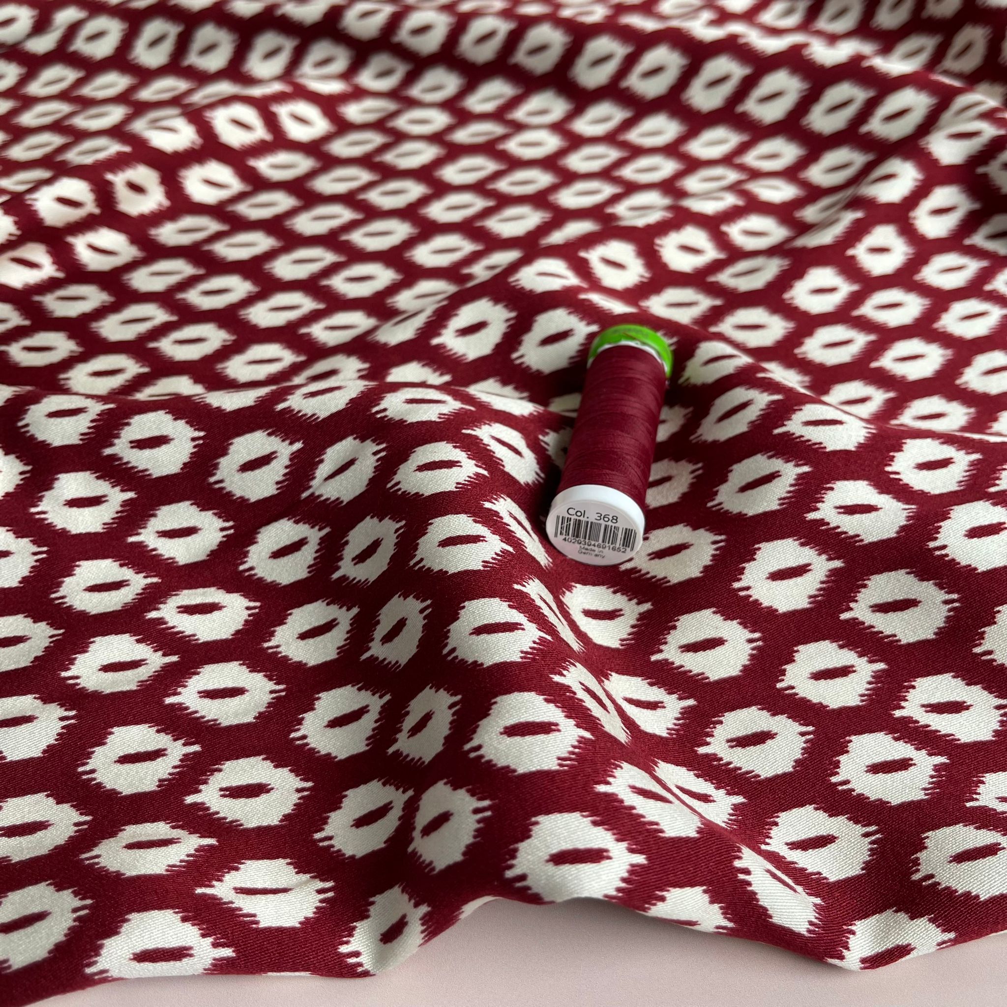 REMNANT 1.79 Metres (plus extra section with slight fading)  - Abstract Rhombus on Burgundy Viscose Twill Sateen Fabric