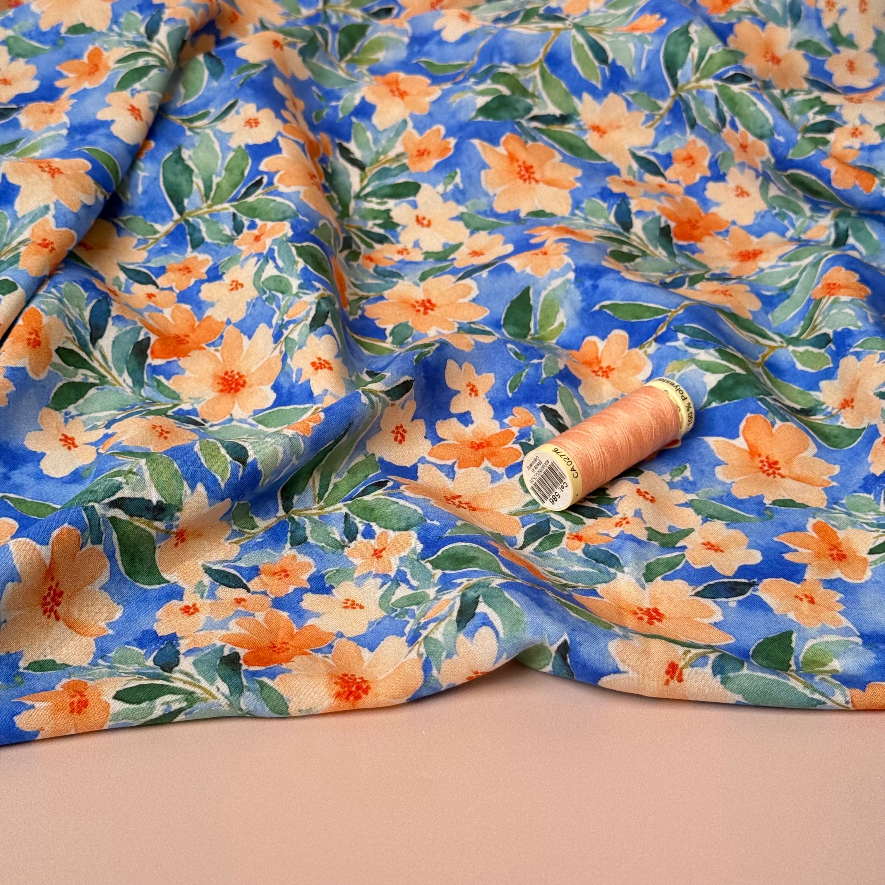 Peach Watercolour Flowers on Blue Viscose Fabric
