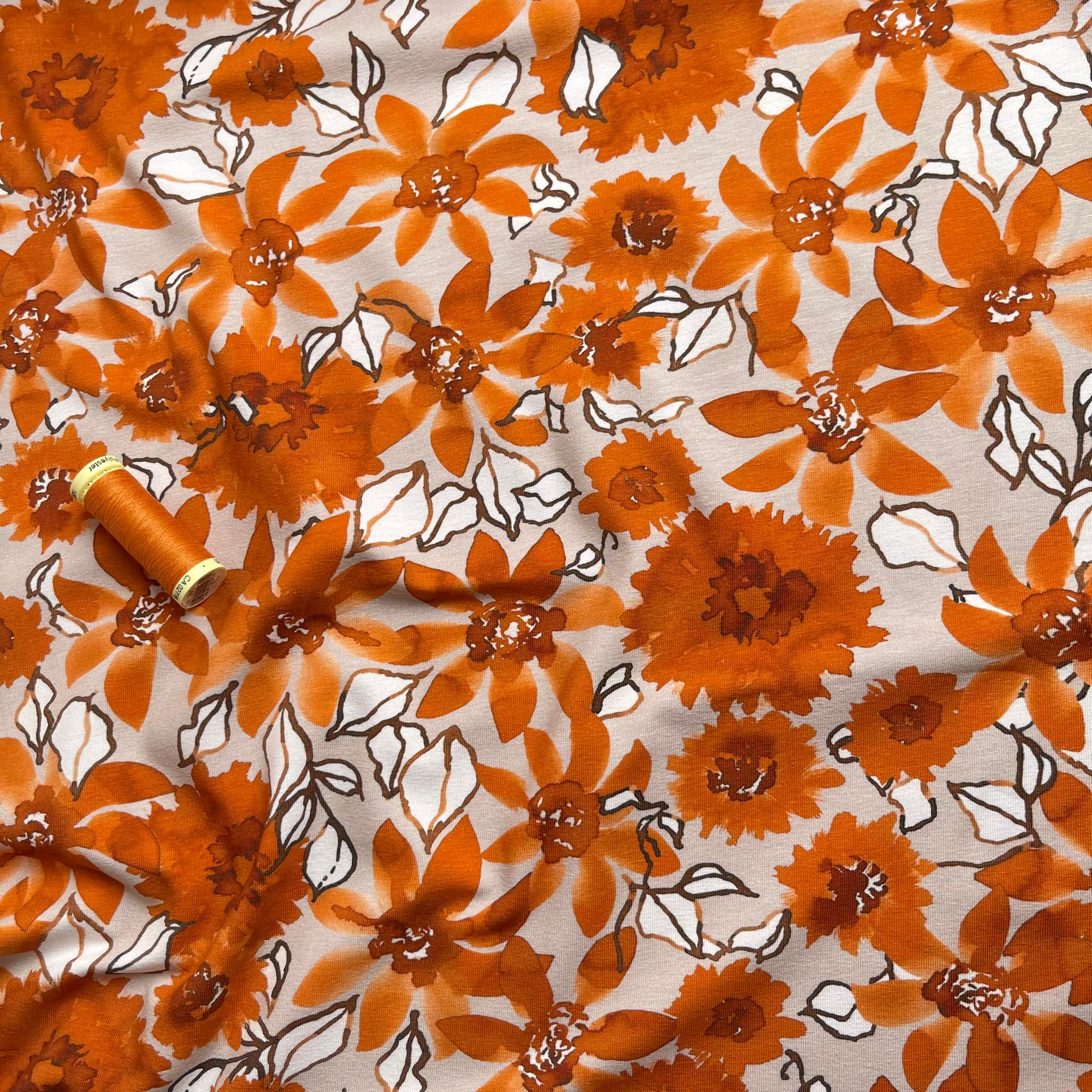 Danish Design - Rust Flowers on Pale Rose Cotton Jersey Fabric