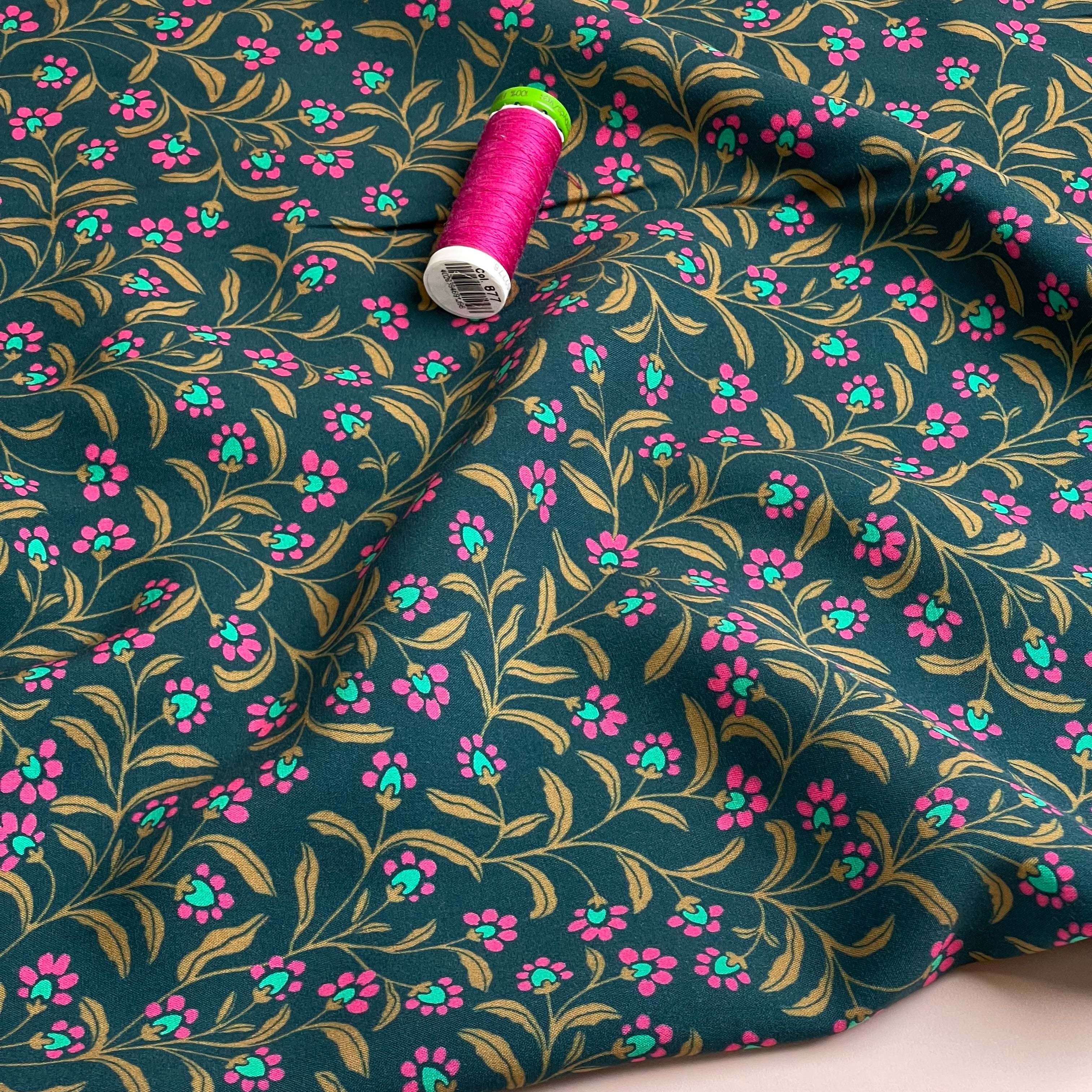 Ditsy Flowers on Green Viscose Fabric