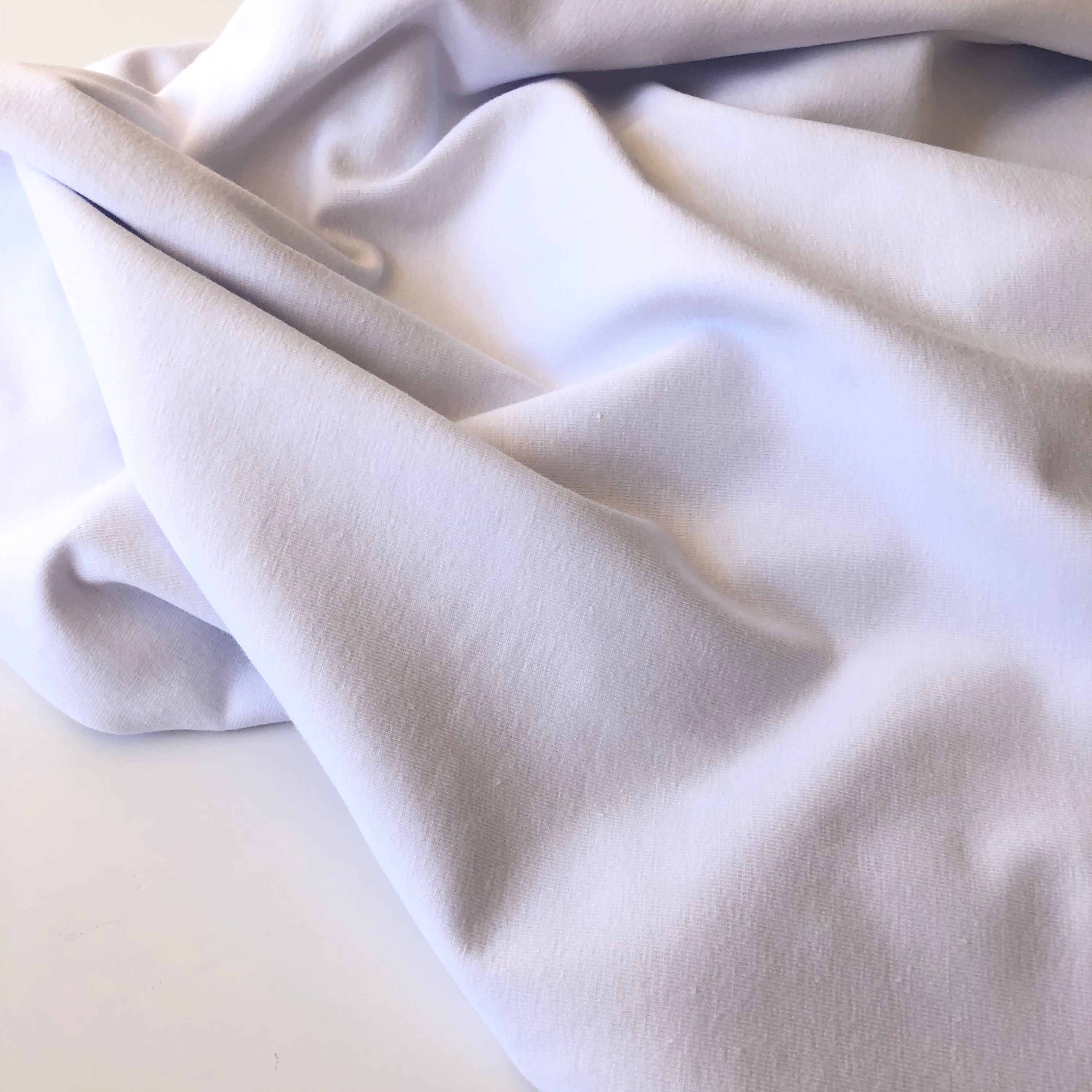 (with dirt marks in places) Essential Chic White Plain Cotton Jersey Fabric