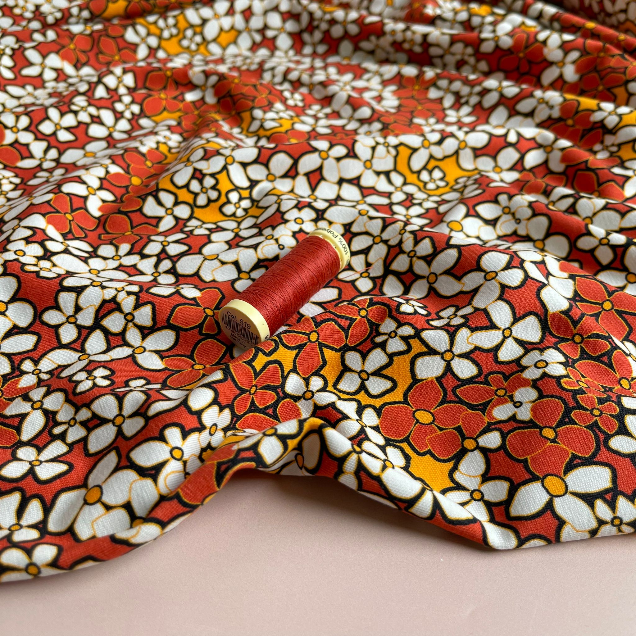 Danish Design - Small Retro Flowers on Burnt Orange Cotton Jersey Fabric