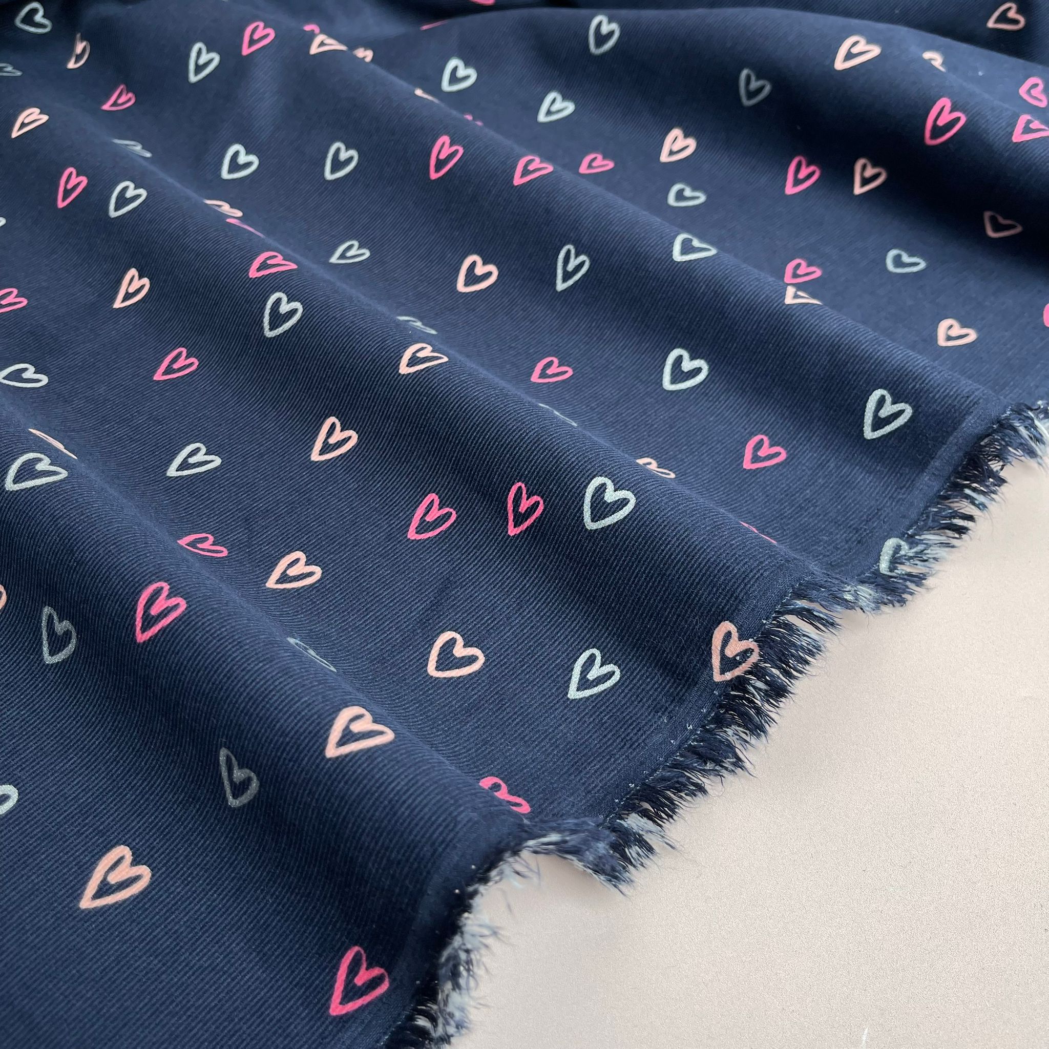 Shimmer Hearts on Navy Cotton Needlecord