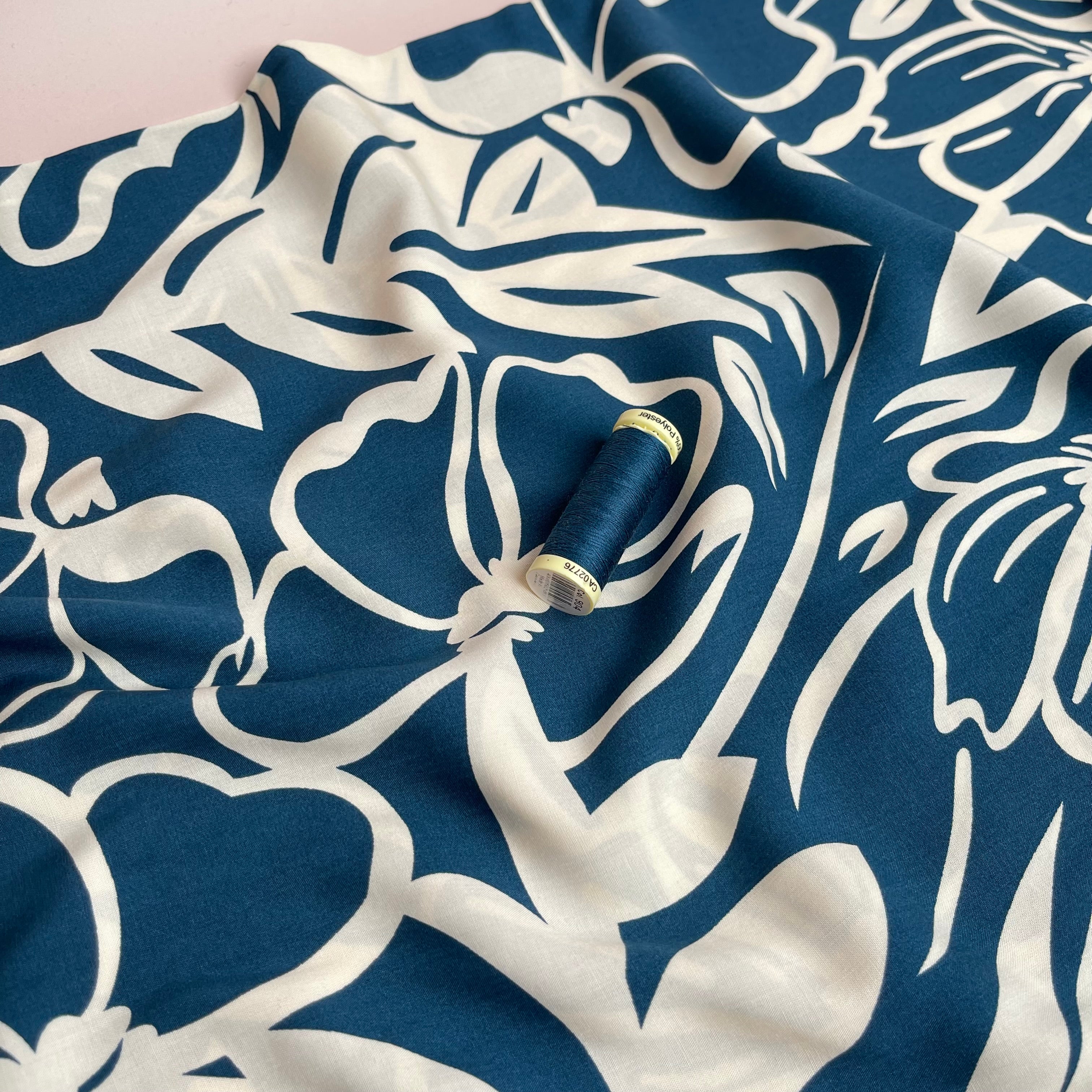 Off-White Blooms on Blue Viscose Fabric