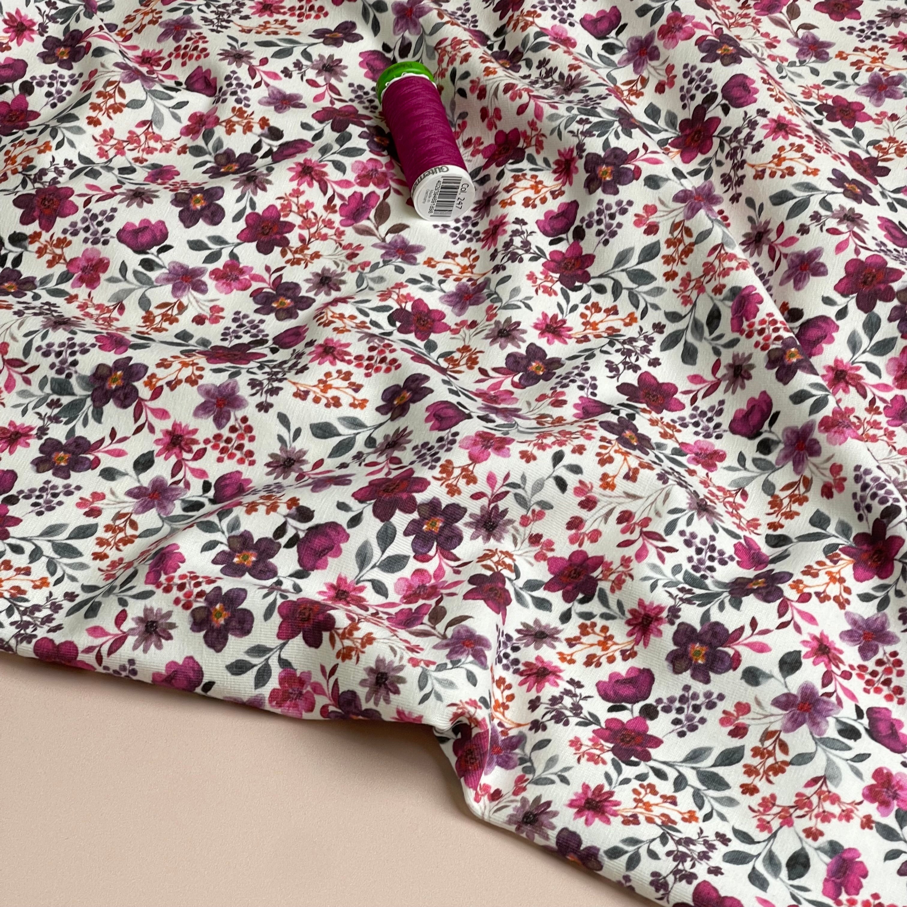 Ditsy Plum Flowers on White Cotton Jersey Fabric