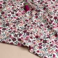 Ditsy Plum Flowers on White Cotton Jersey Fabric