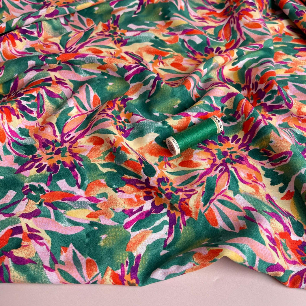 Vibrant Blooms on Green Viscose Fabric