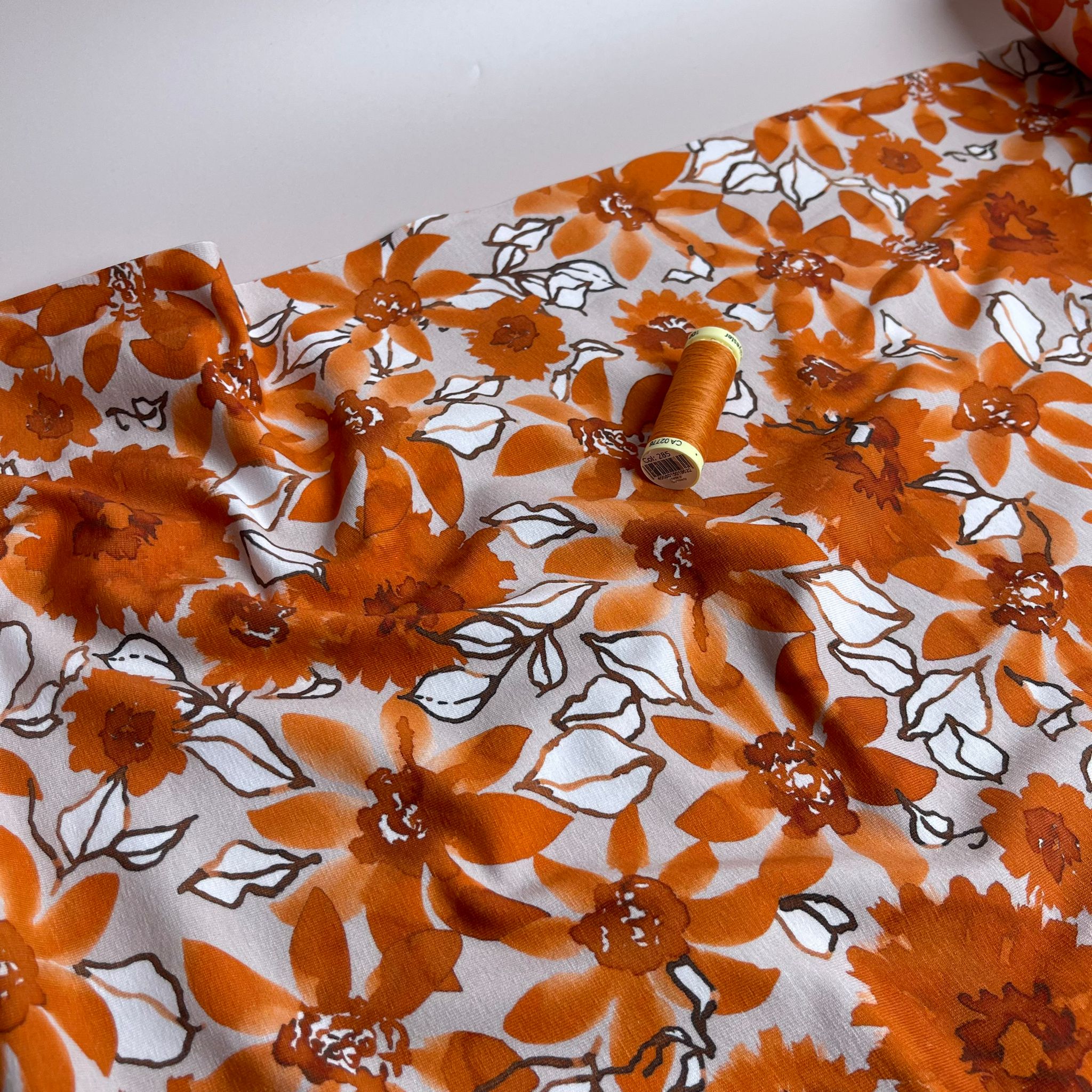 Danish Design - Rust Flowers on Pale Rose Cotton Jersey Fabric