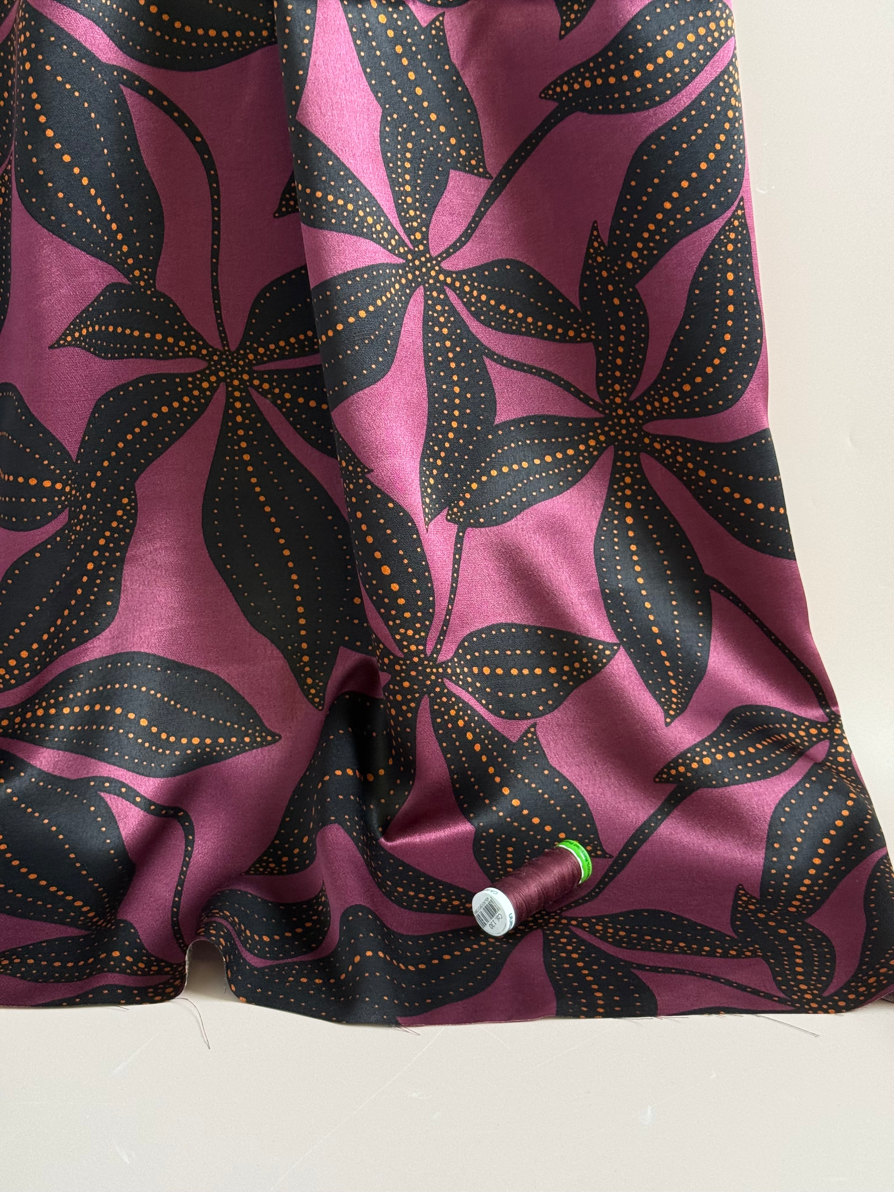 Spoty Flowers on Wine Spun Viscose Sateen Fabric