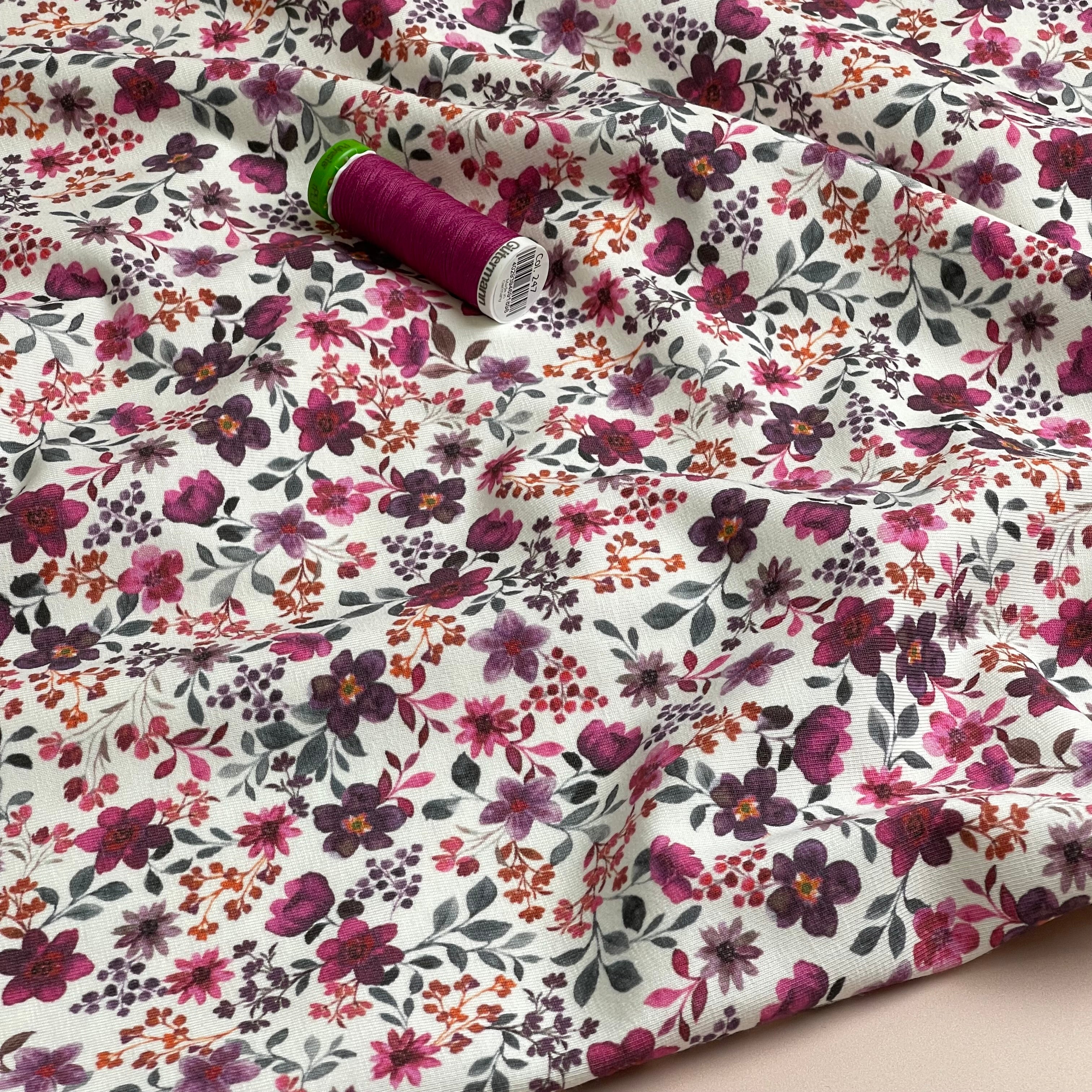 Ditsy Plum Flowers on White Cotton Jersey Fabric