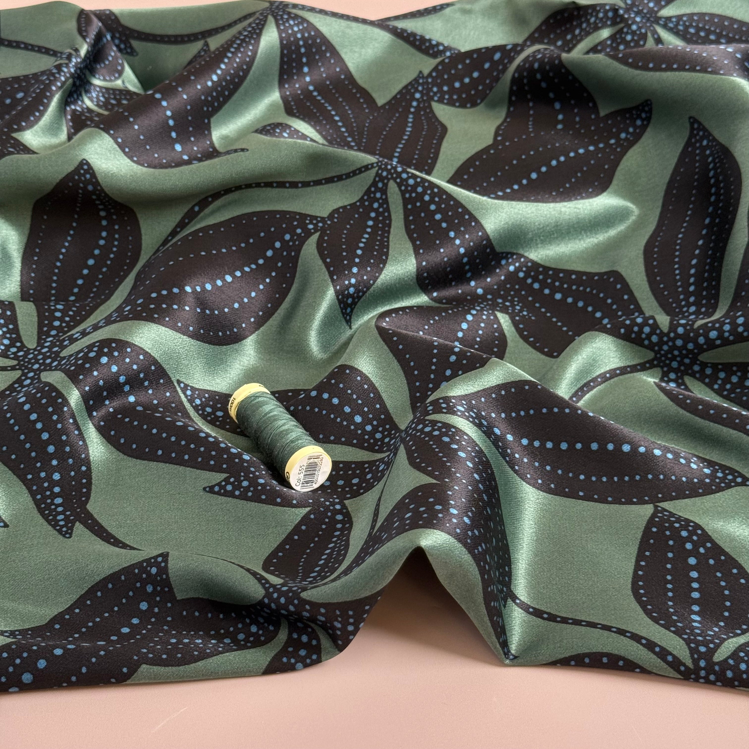 Spotty Flowers on Green Spun Viscose Sateen Fabric