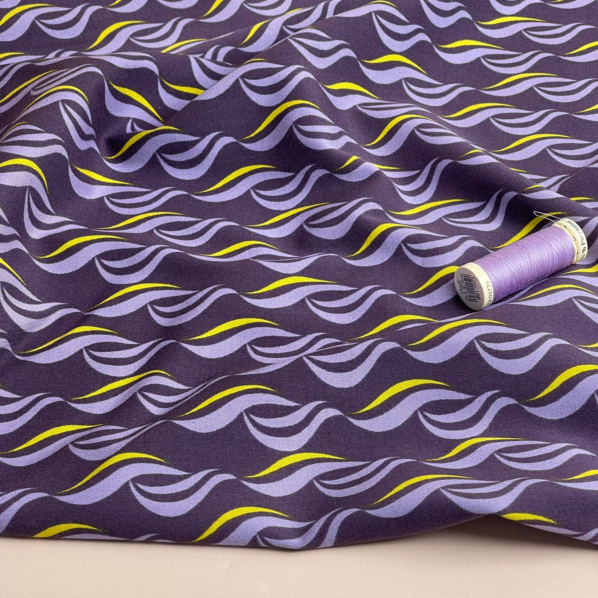 Rosella Waves on Purple Viscose Twill with Stretch