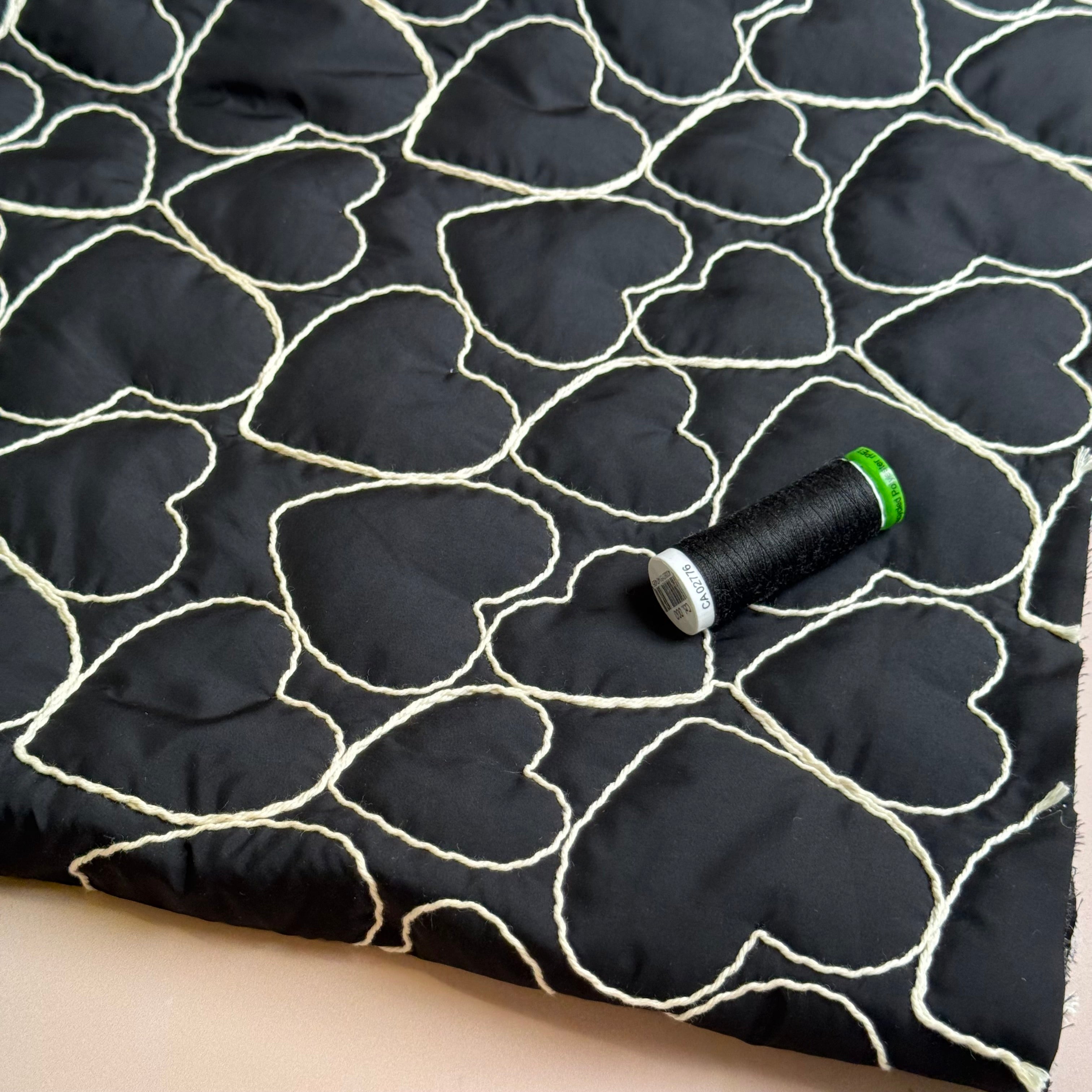 Embroidered Hearts on Black Quilted Fabric