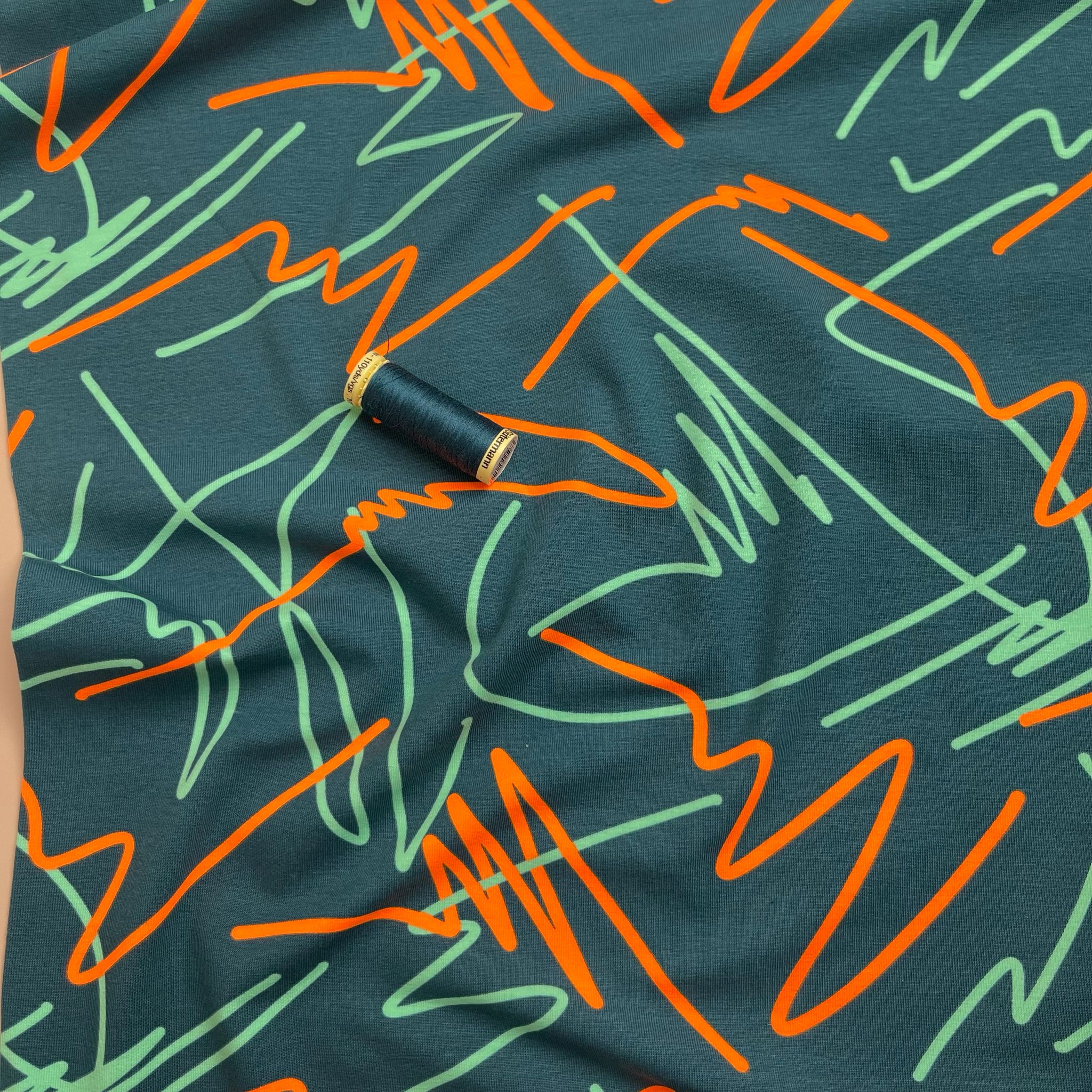 Neon Doodles on Dark Teal Cotton Jersey Fabric