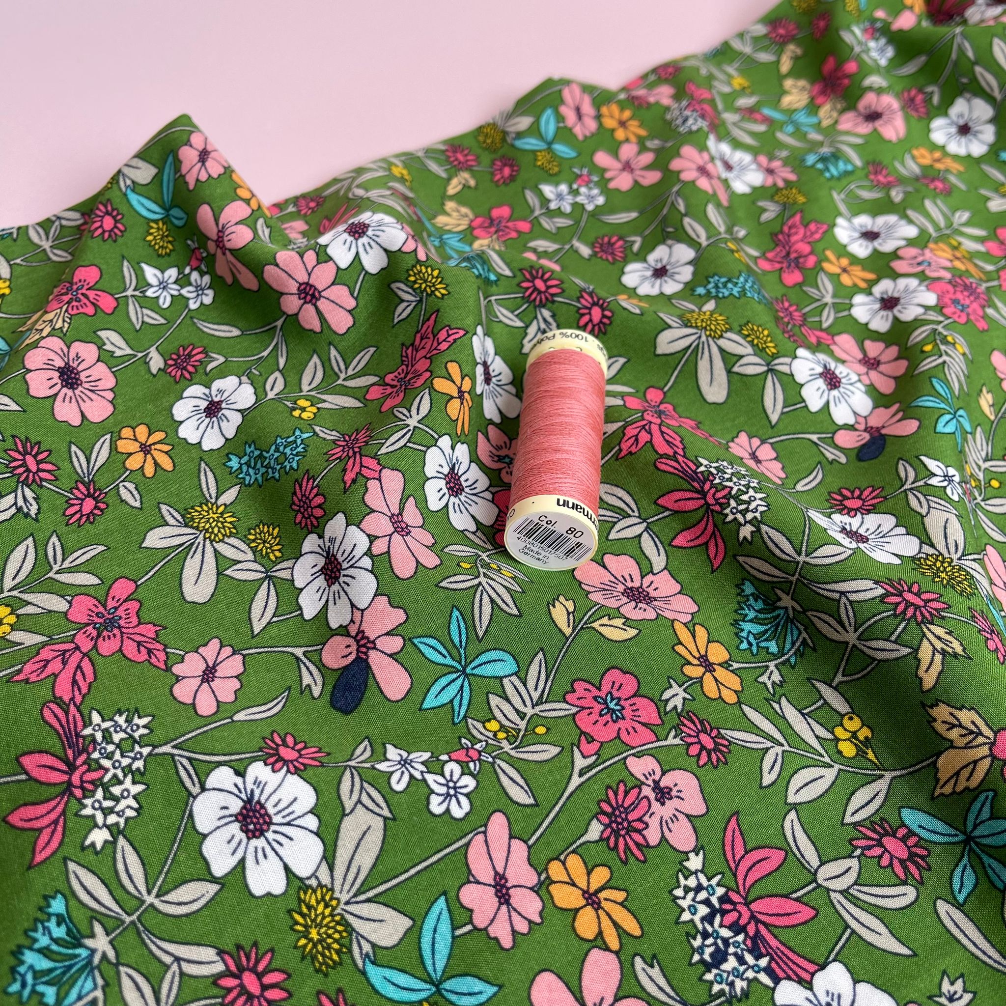 Spring Blossoms on Green Viscose Fabric