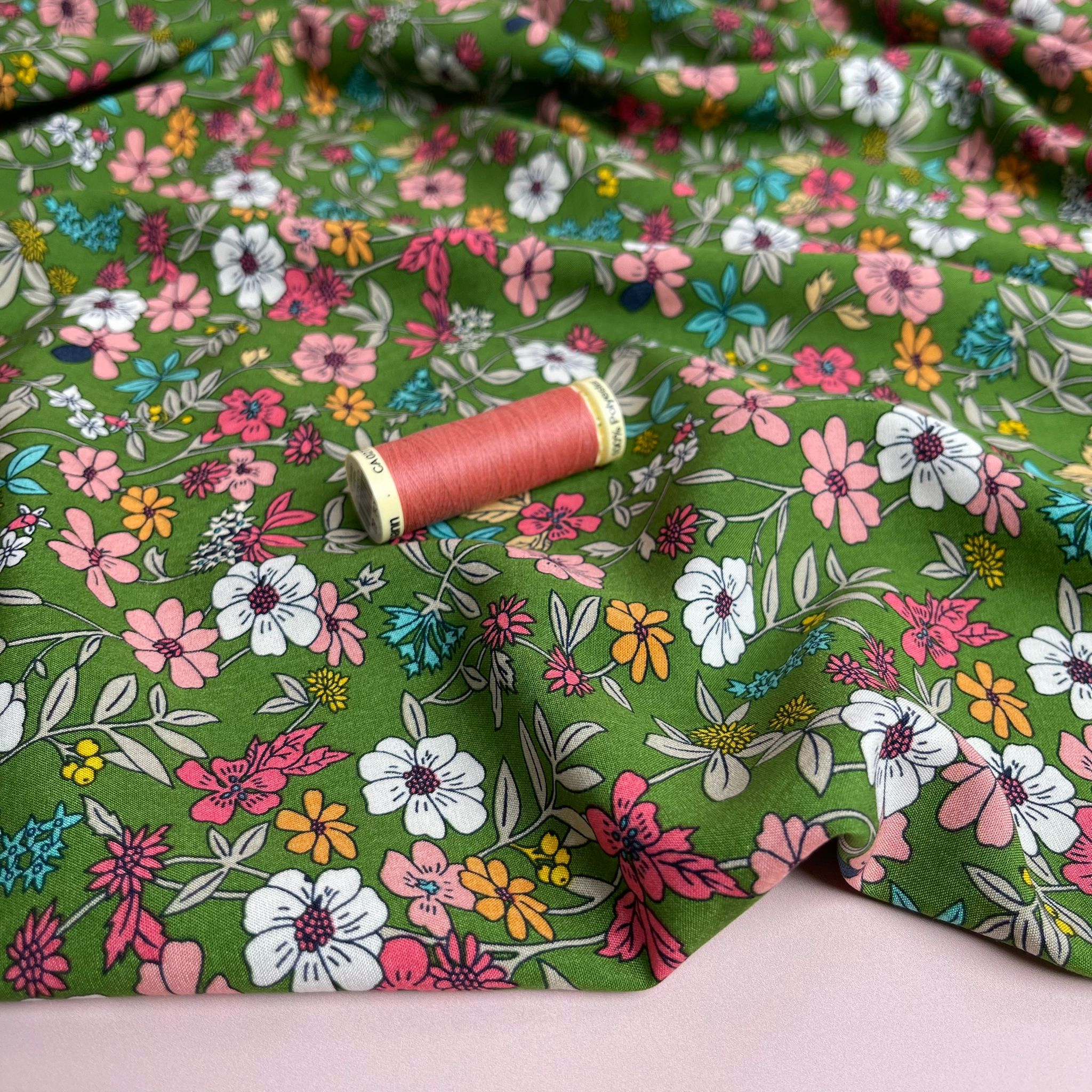 Spring Blossoms on Green Viscose Fabric