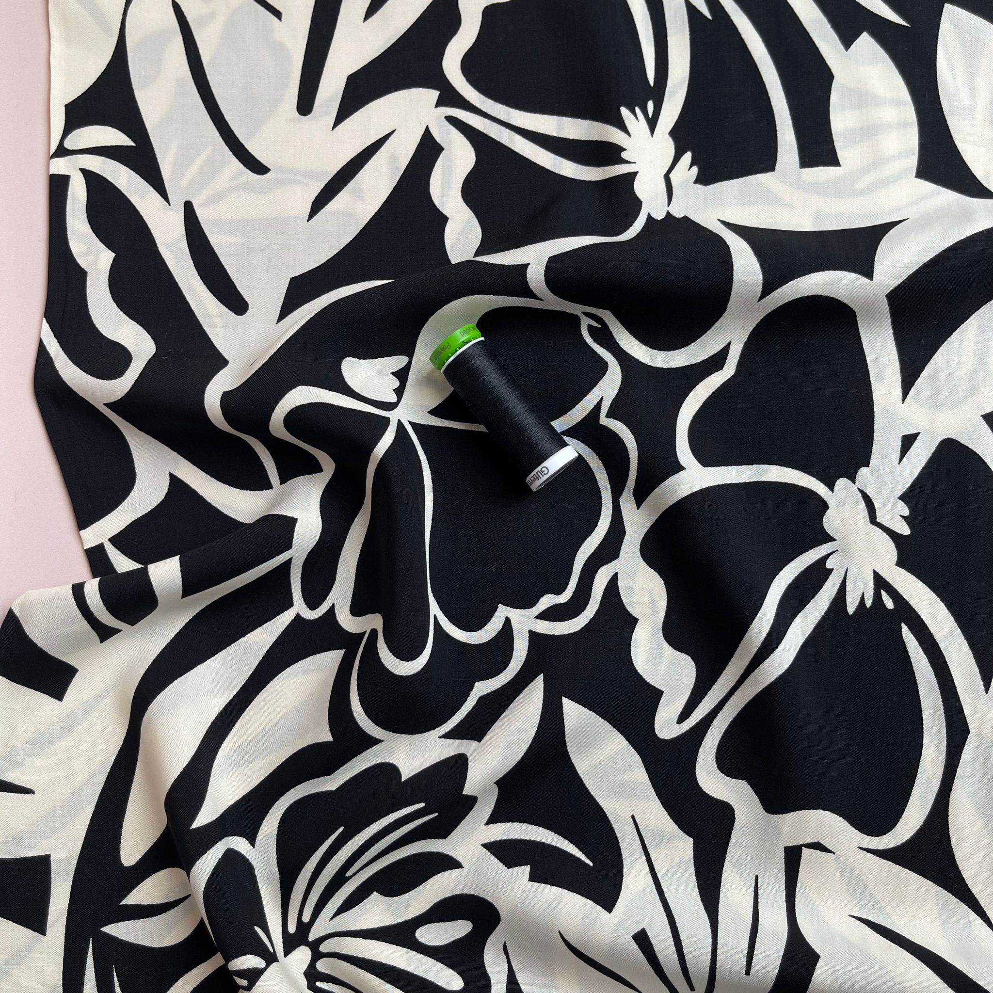 Off-White Blooms on Black Viscose Fabric