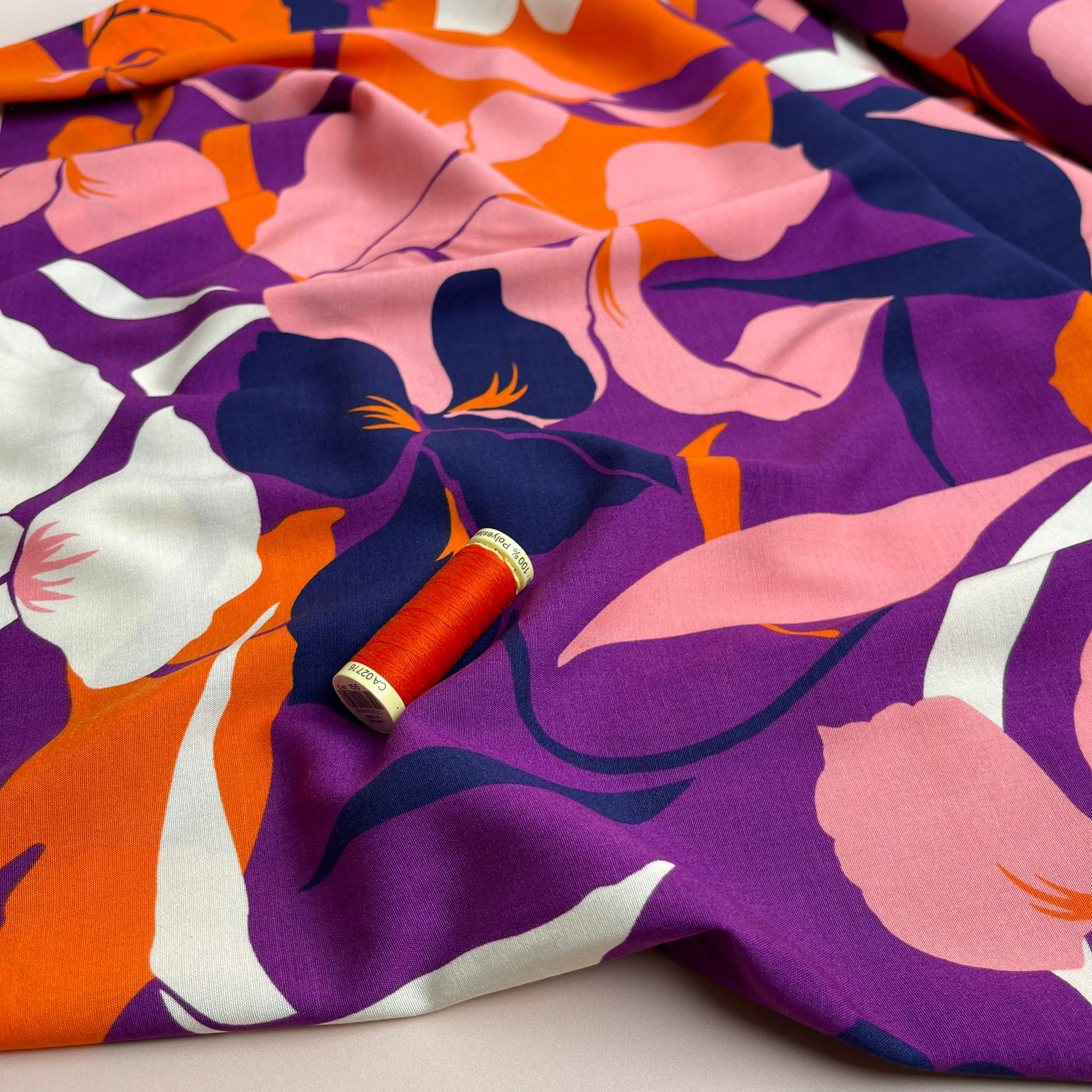 Bold Blooms on Purple Stretch Viscose Poplin Fabric