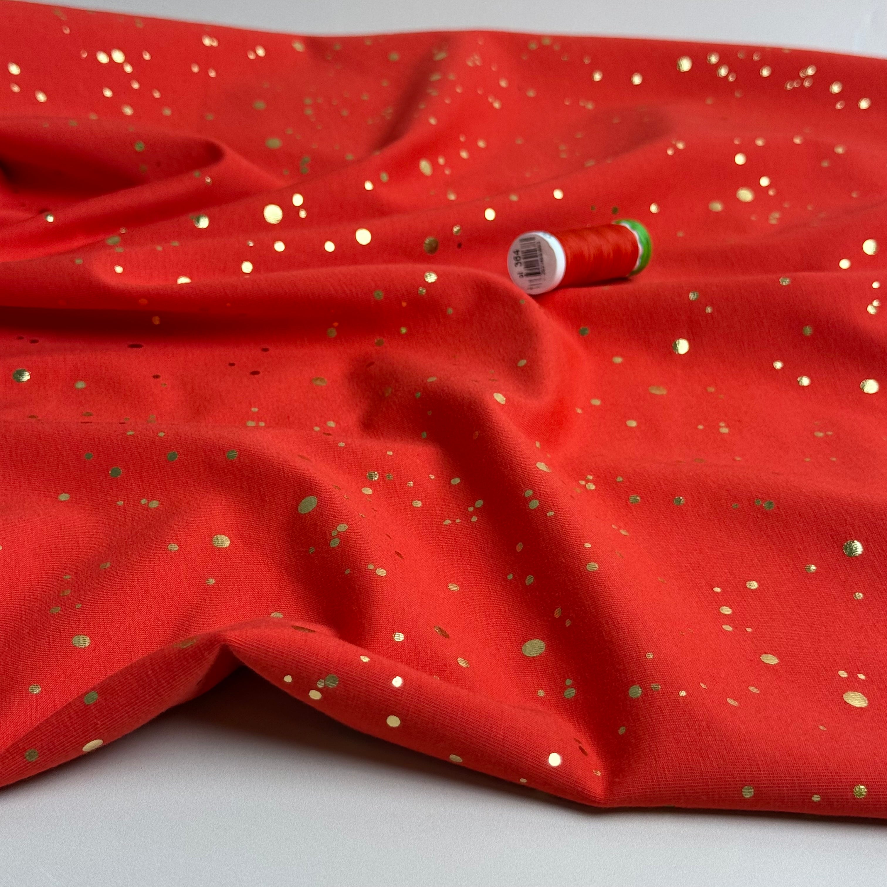 Gold Confetti on Bright Red Cotton Jersey Fabric