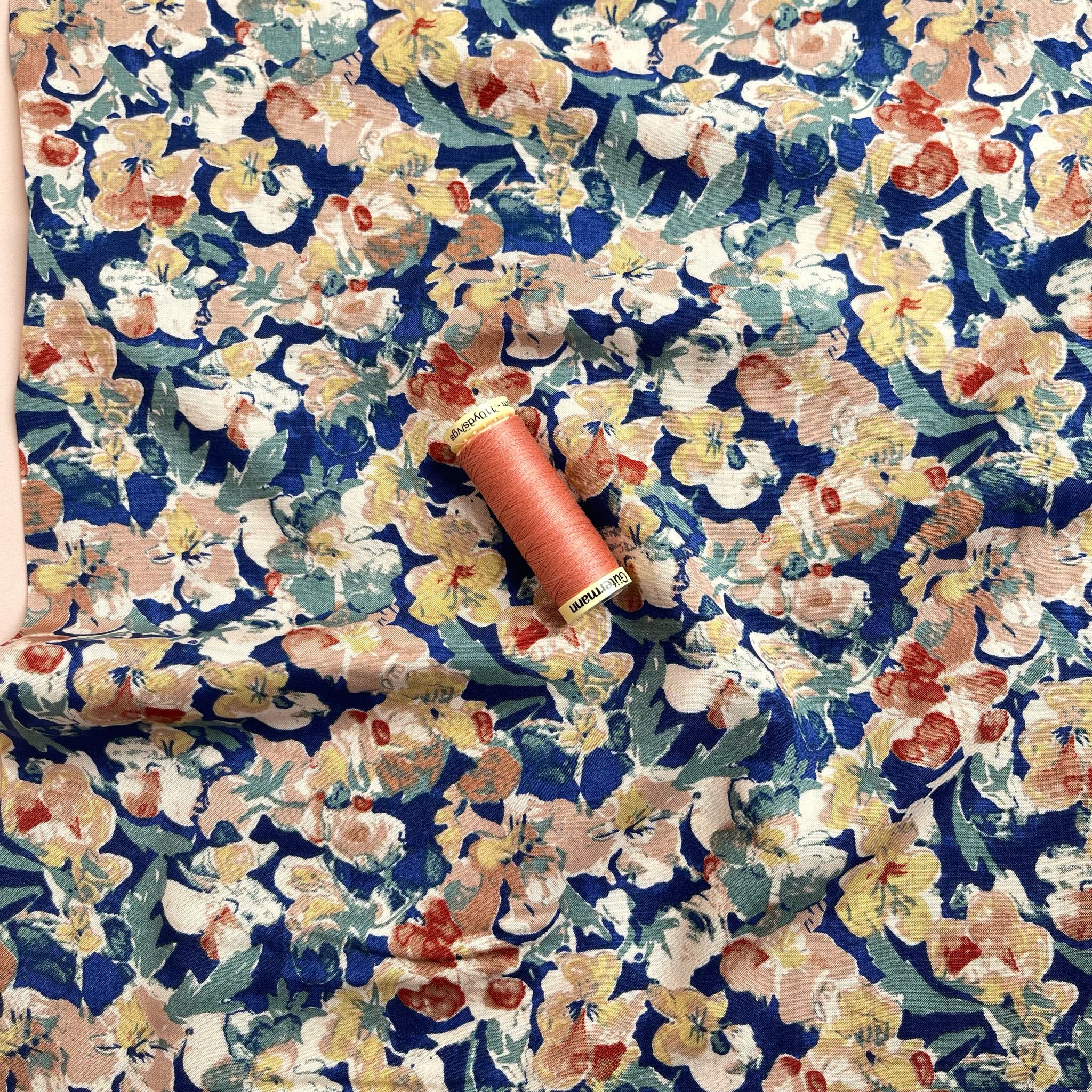 Soft Autumn Blossoms on Blue Viscose Fabric