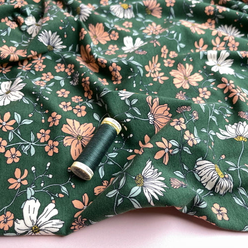 Peach Flowers on Green Cotton Jersey Fabric