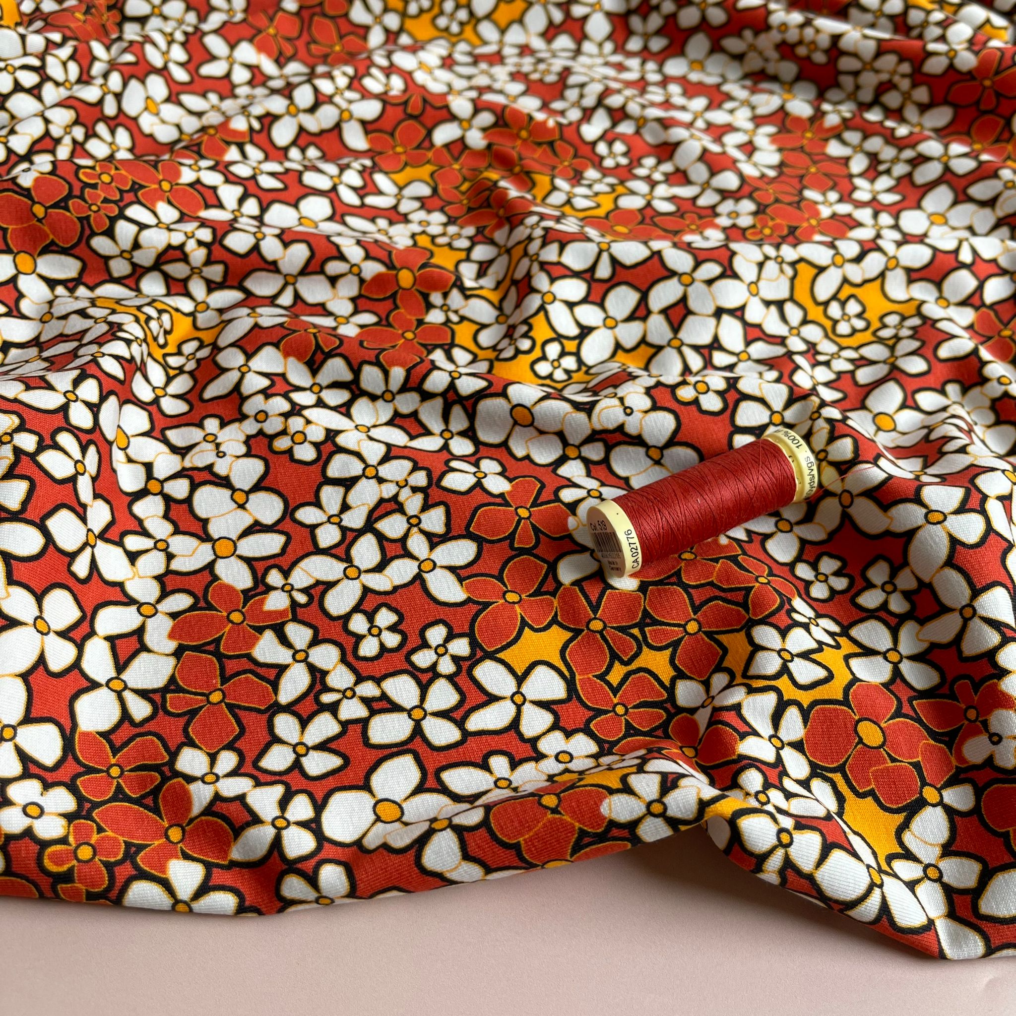 Danish Design - Small Retro Flowers on Burnt Orange Cotton Jersey Fabric