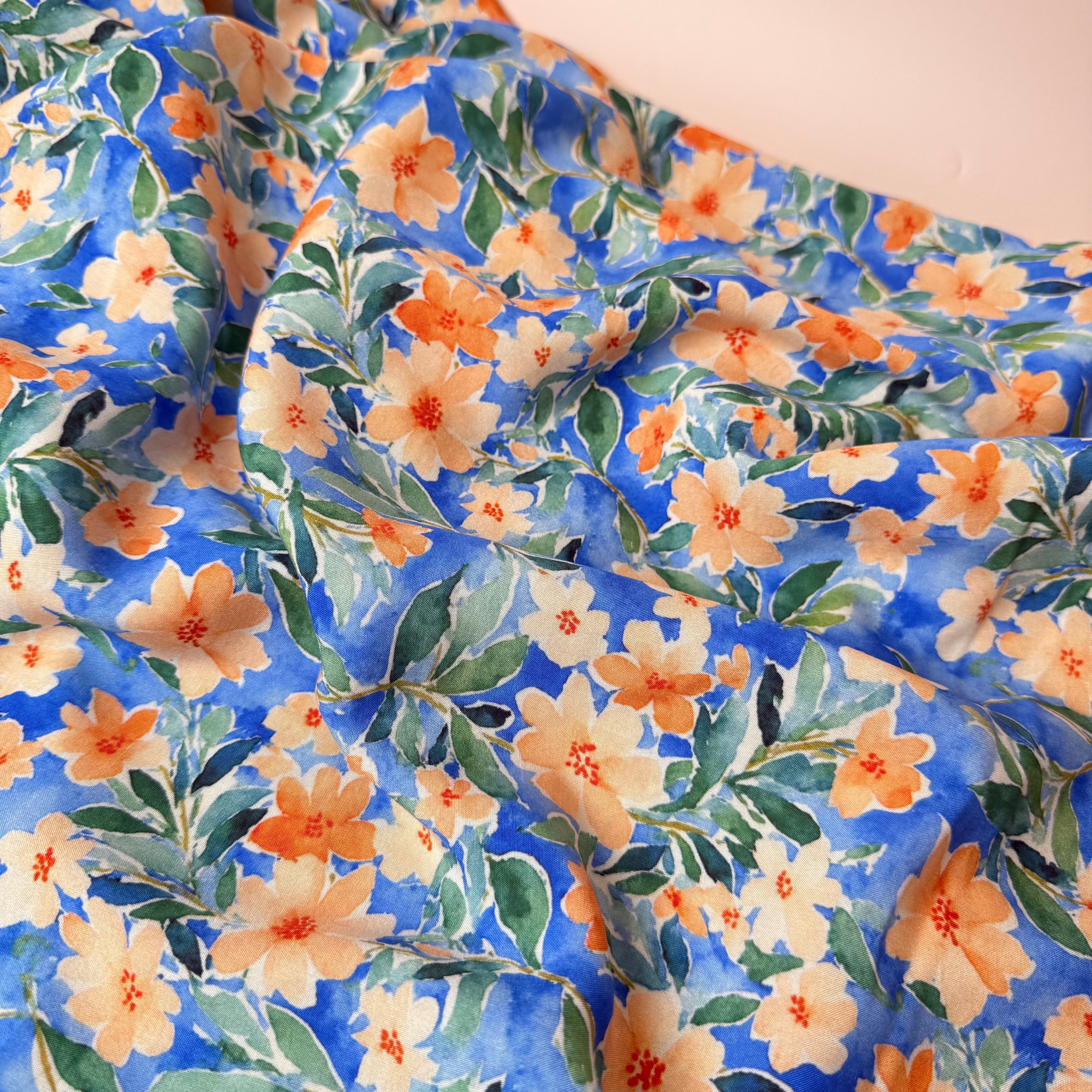 Peach Watercolour Flowers on Blue Viscose Fabric