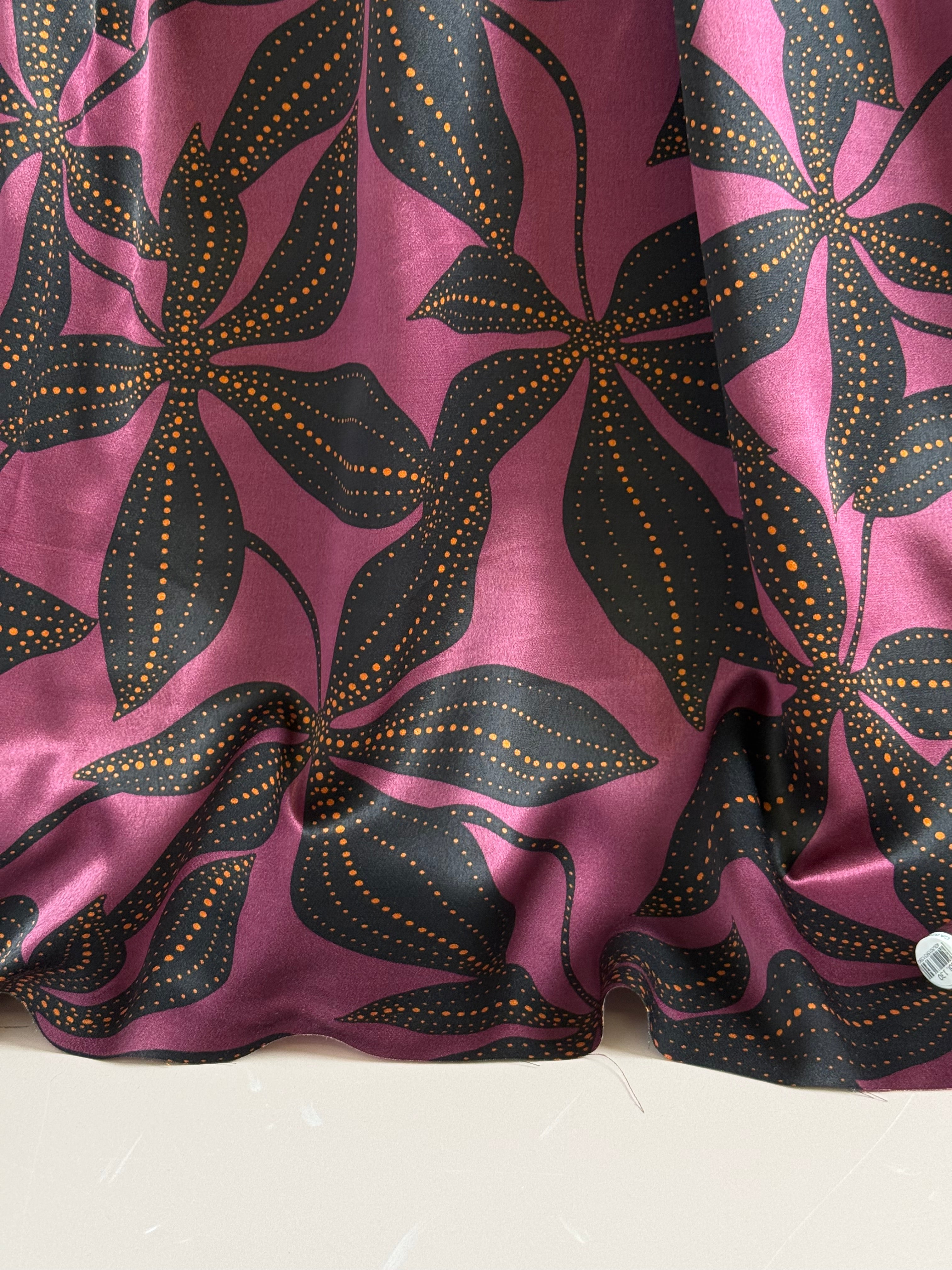 Spoty Flowers on Wine Spun Viscose Sateen Fabric