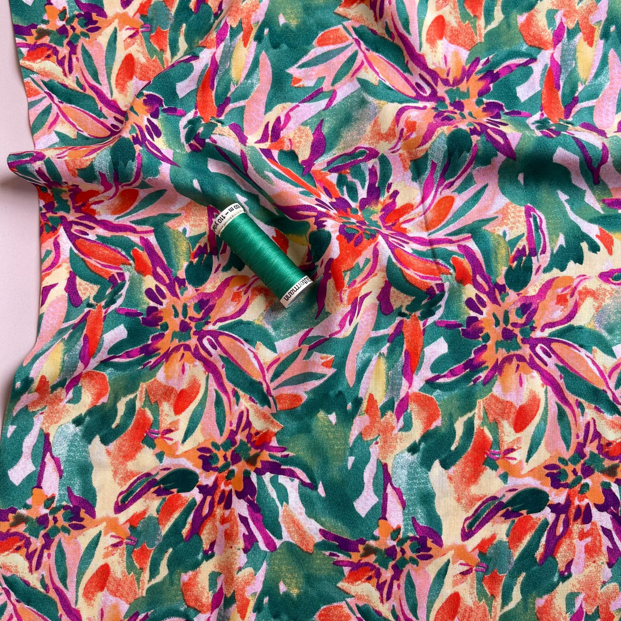 Vibrant Blooms on Green Viscose Fabric