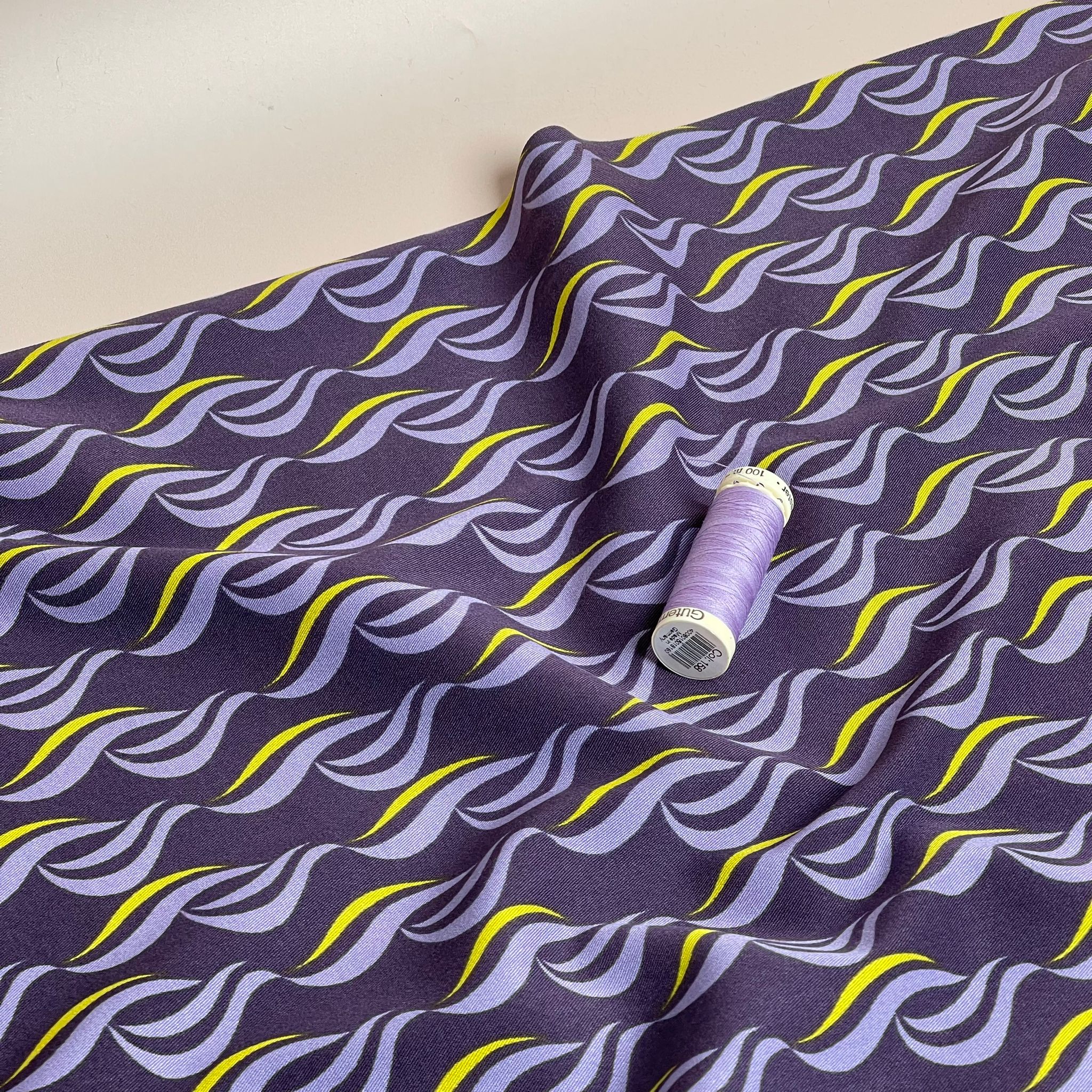 Rosella Waves on Purple Viscose Twill with Stretch