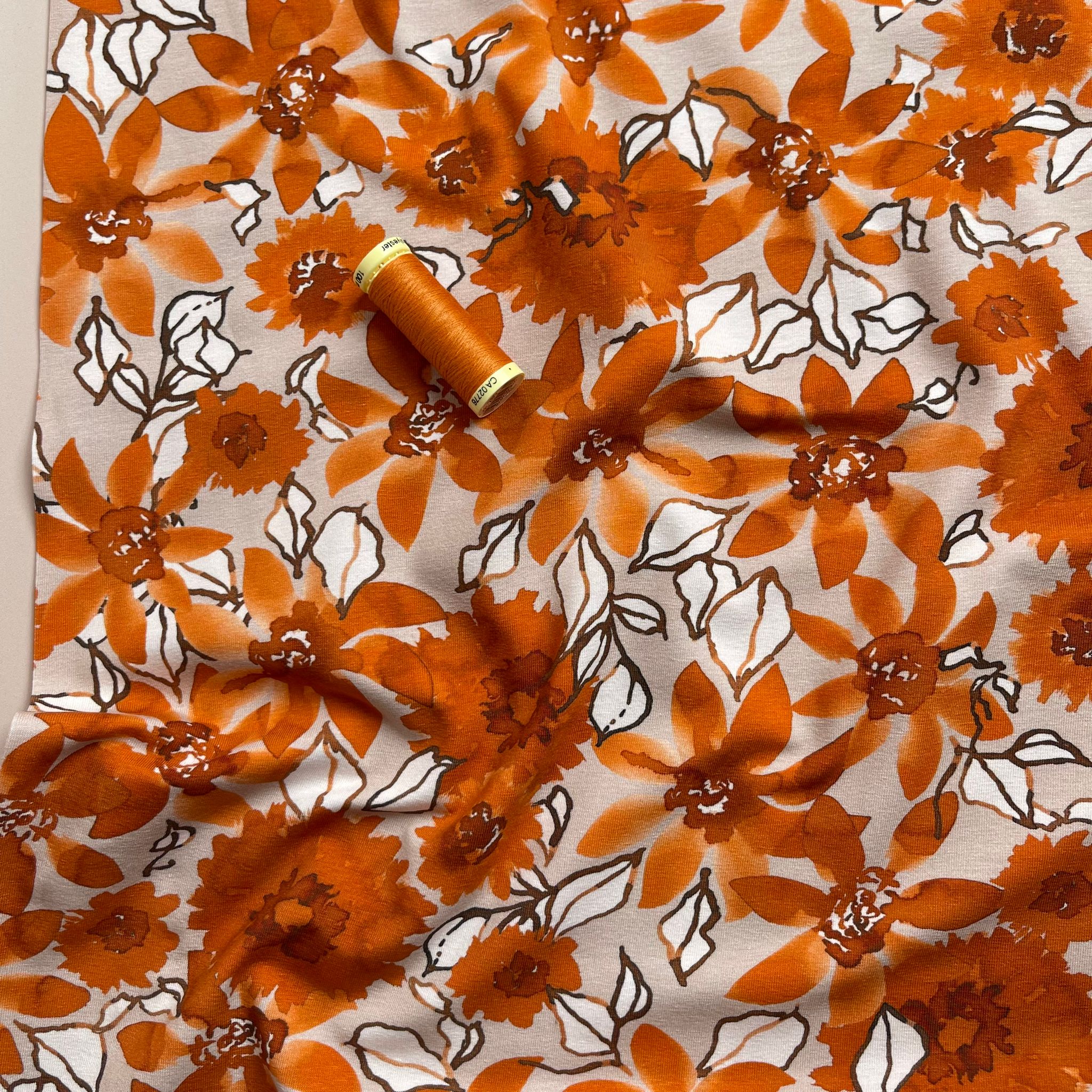 Danish Design - Rust Flowers on Pale Rose Cotton Jersey Fabric