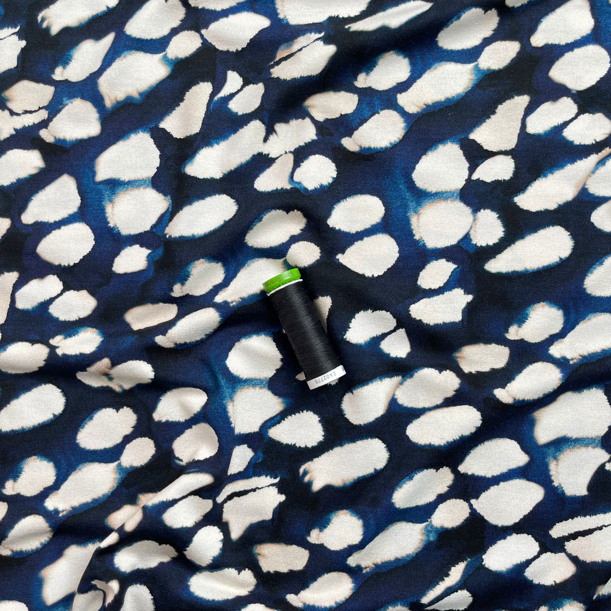 Ex-Designer Deadstock Fuzzy Raindrops on Navy Blue Viscose Jersey Fabric