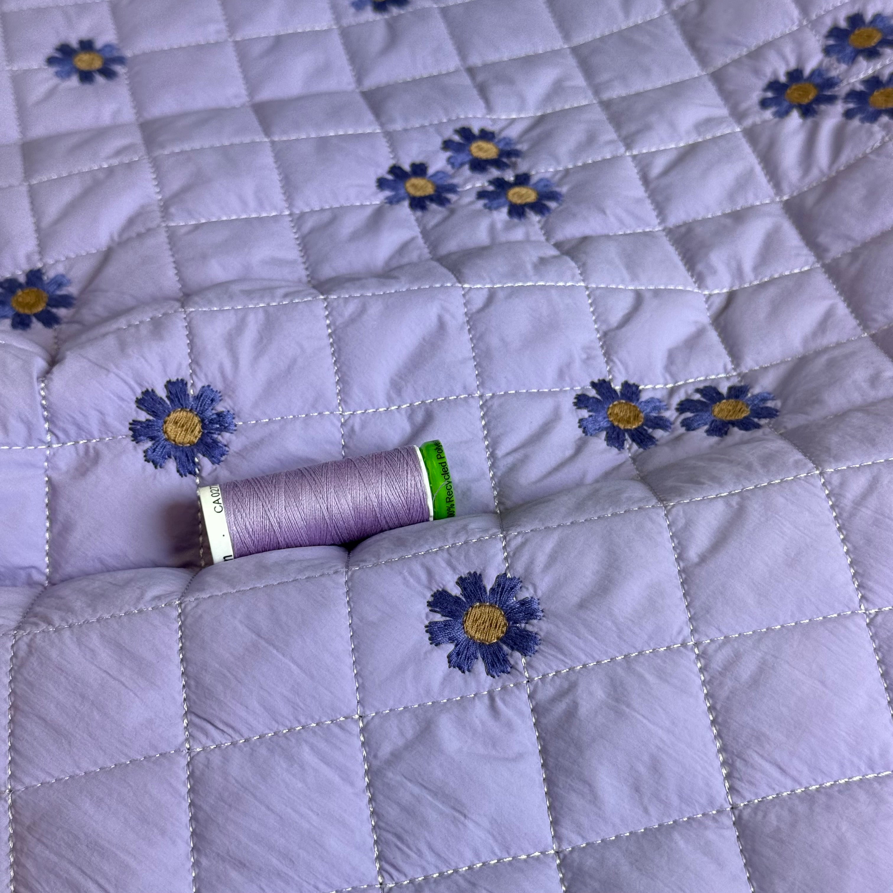 Embroidered Flowers on Lilac Quilted Fabric